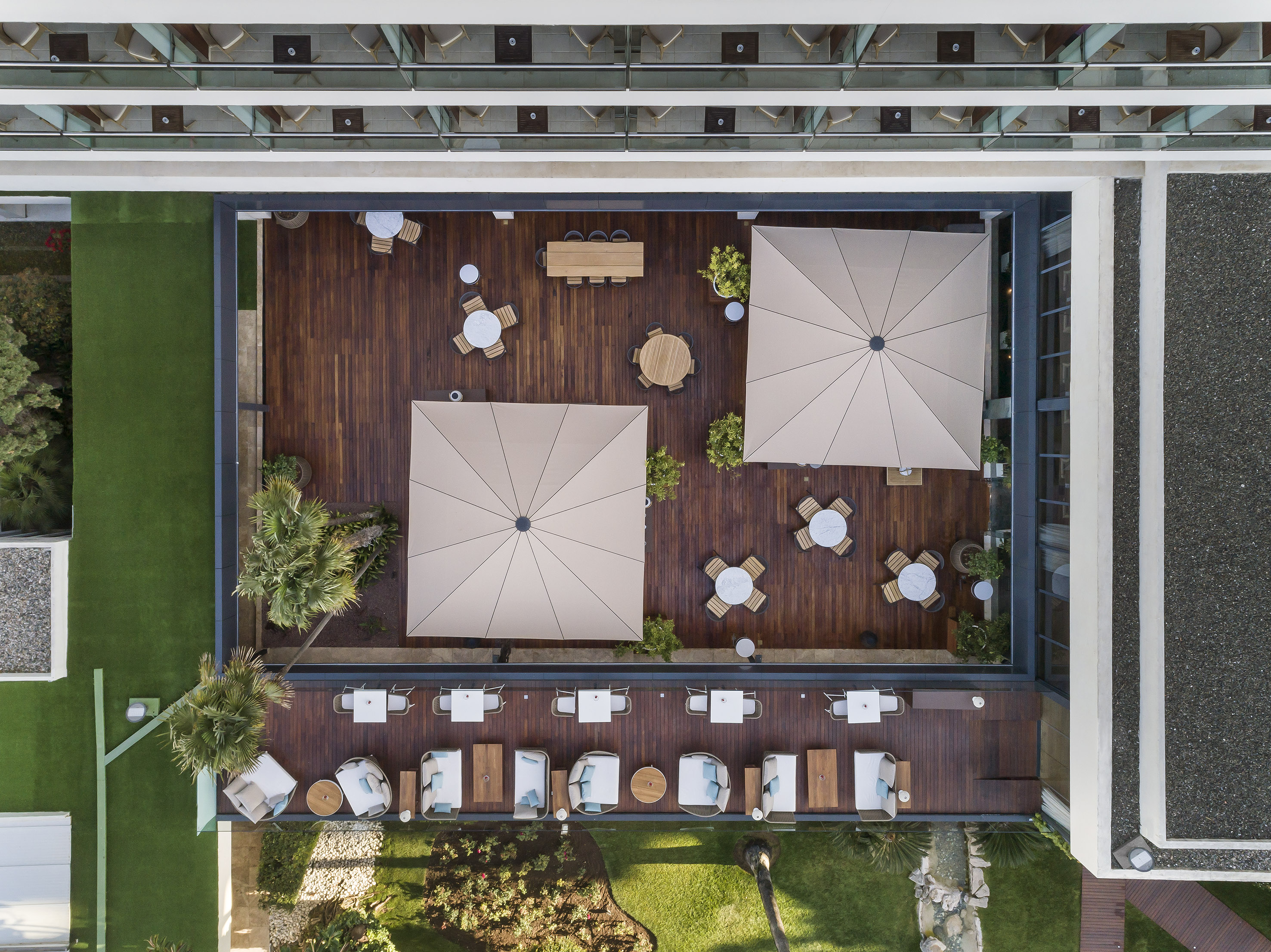 an aerial view of a patio area with tables and chairs