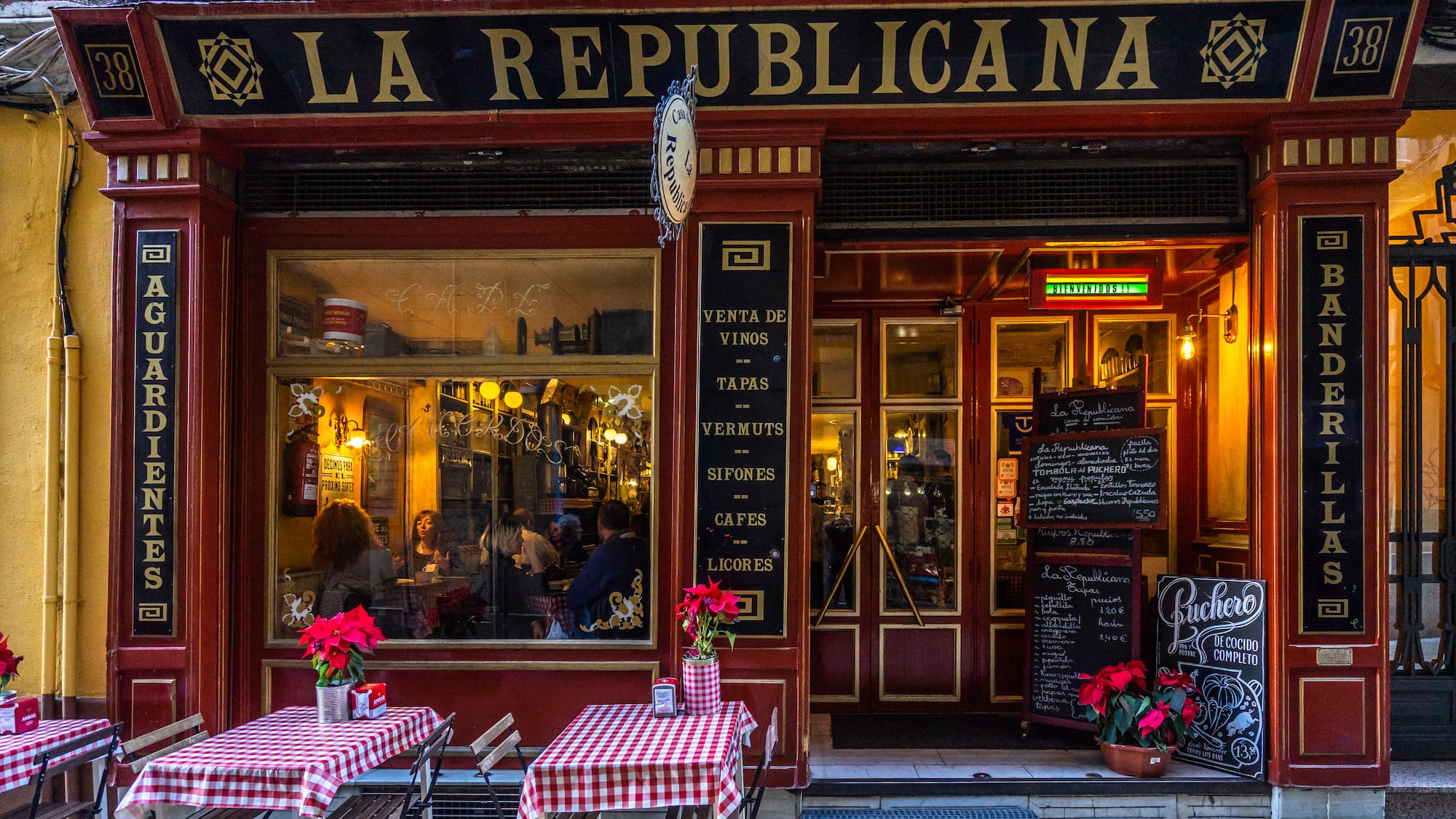 a restaurant with tables and chairs outside
