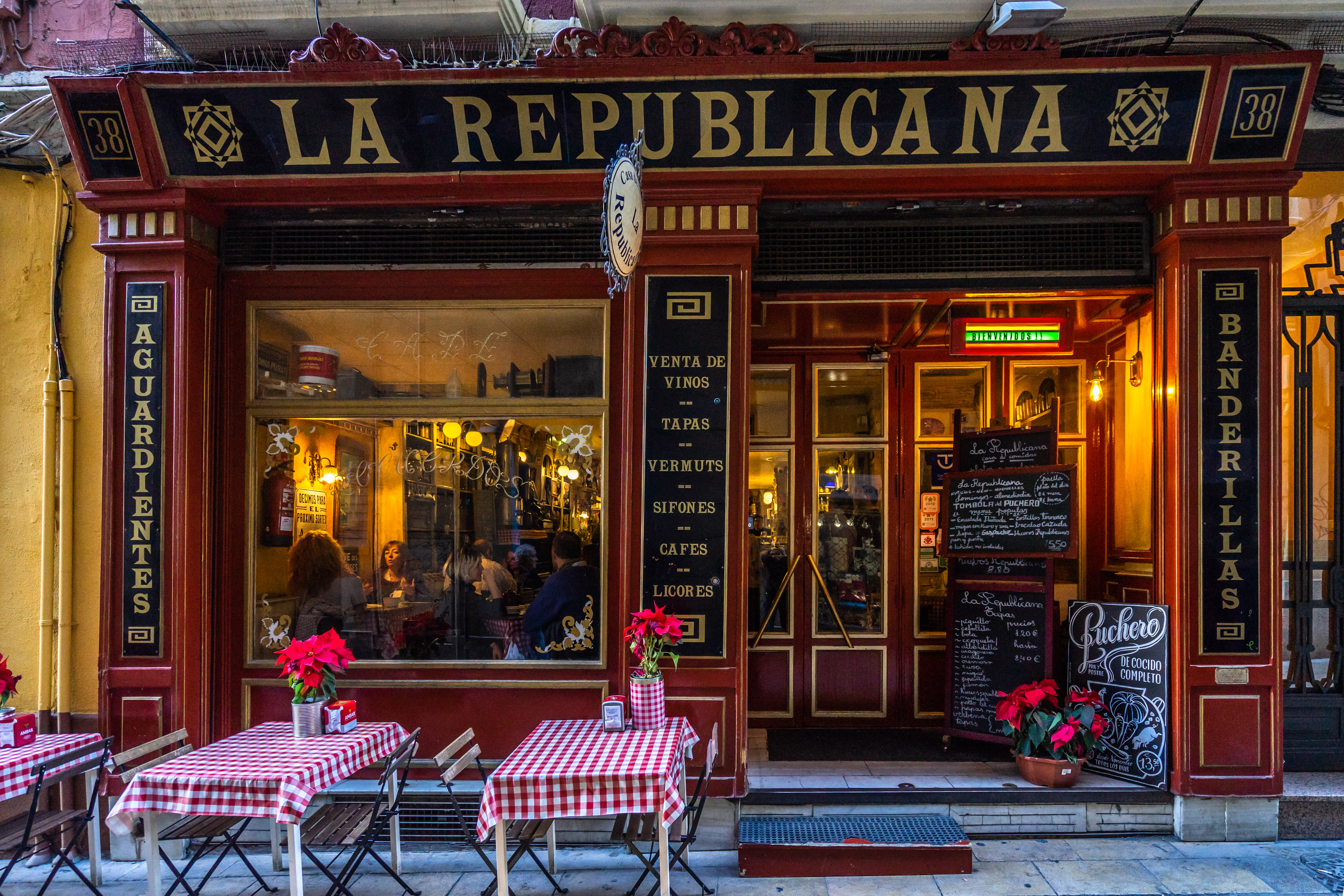 a restaurant with tables and chairs outside