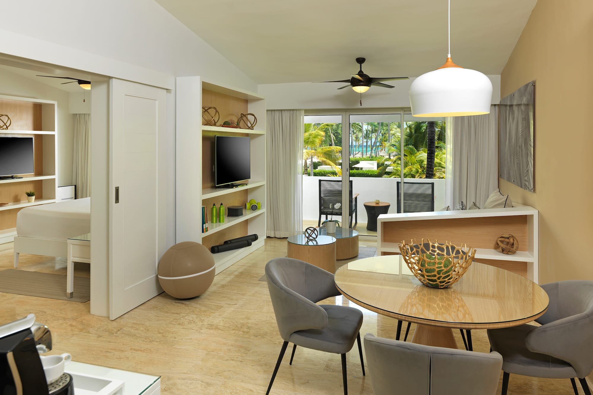 a living room with a table and chairs