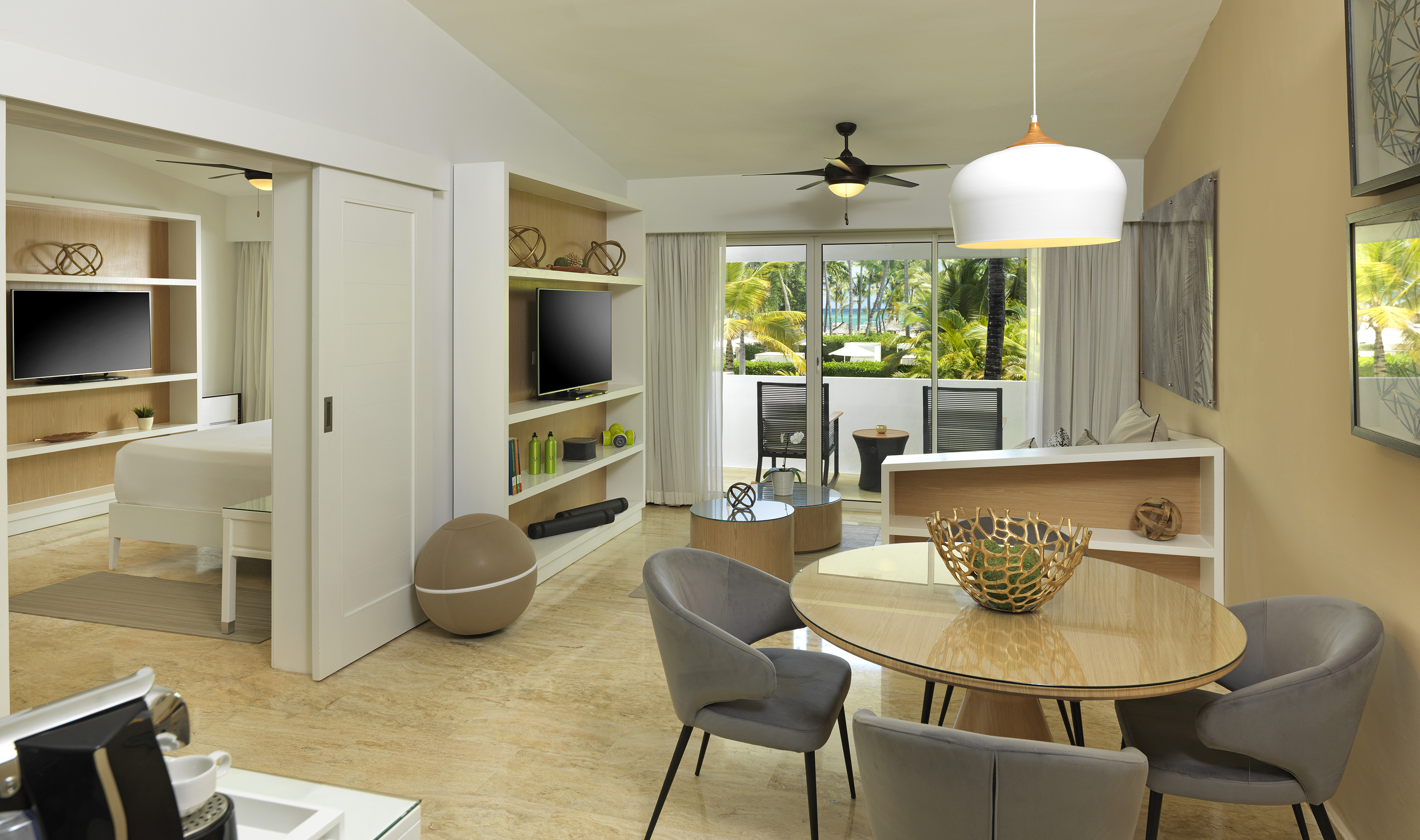a living room with a table and chairs