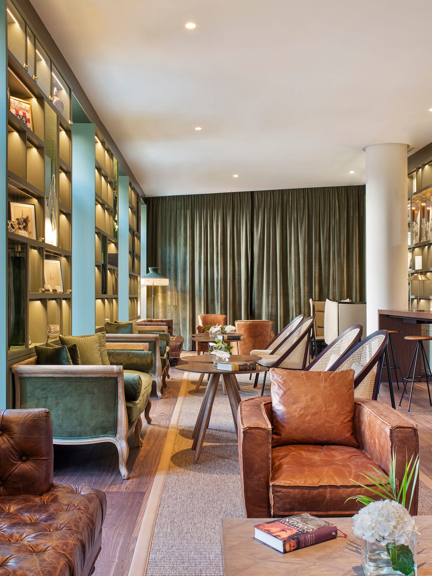 a room with a couch and chairs