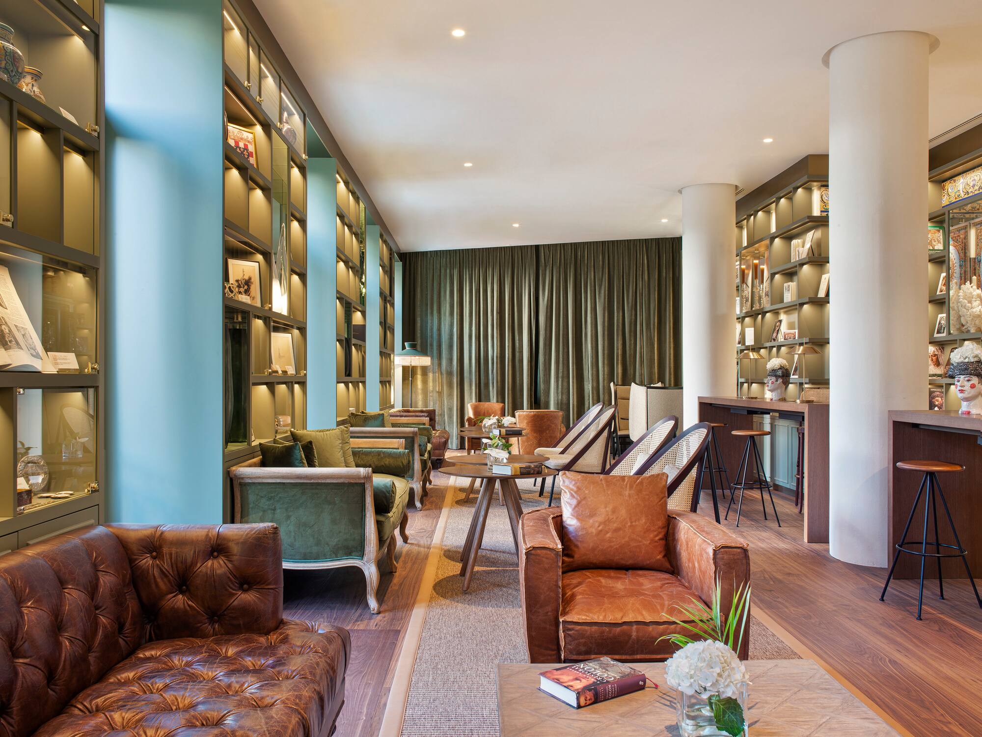 a room with a couch and chairs