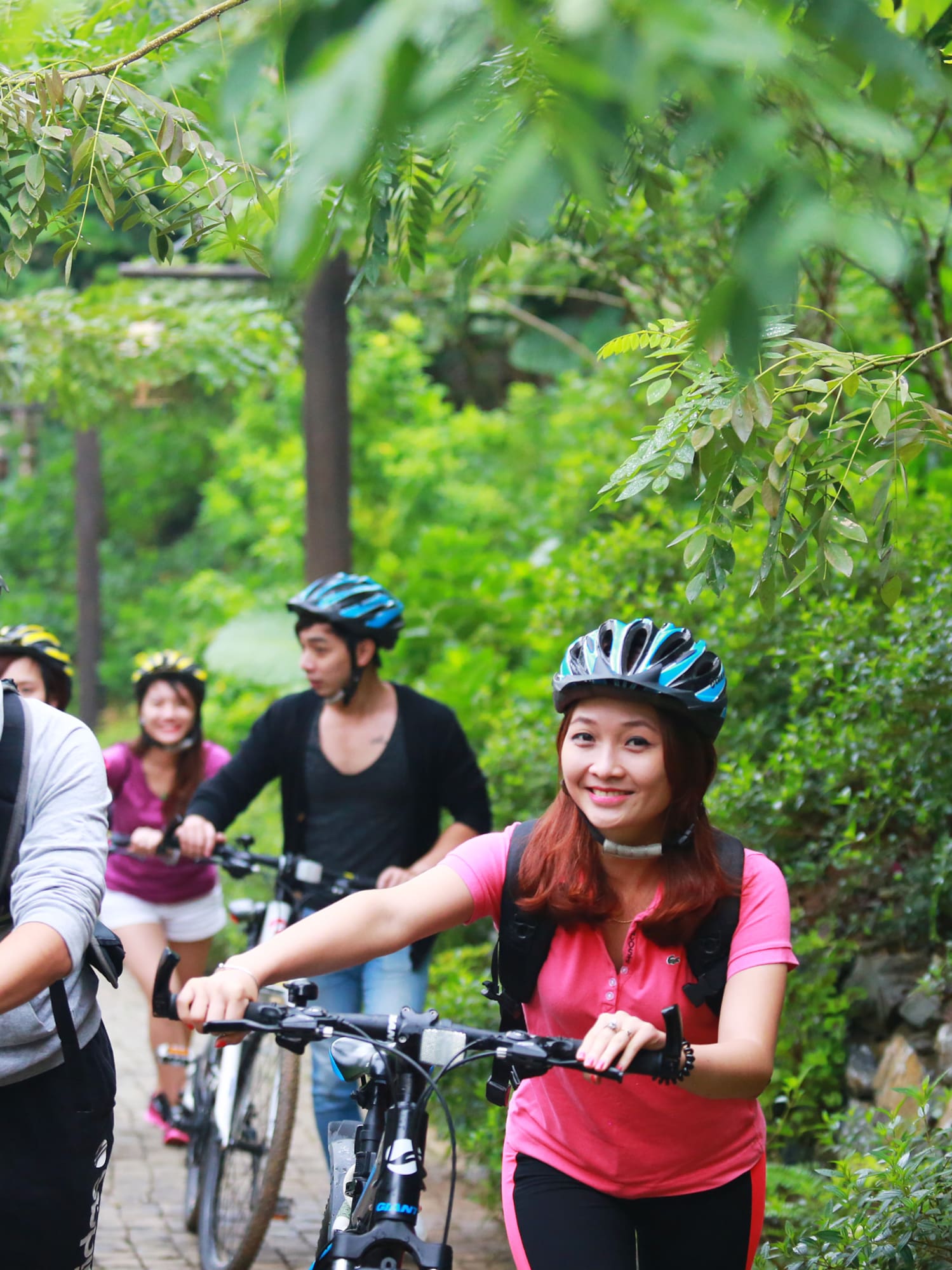 a group of people riding bikes
