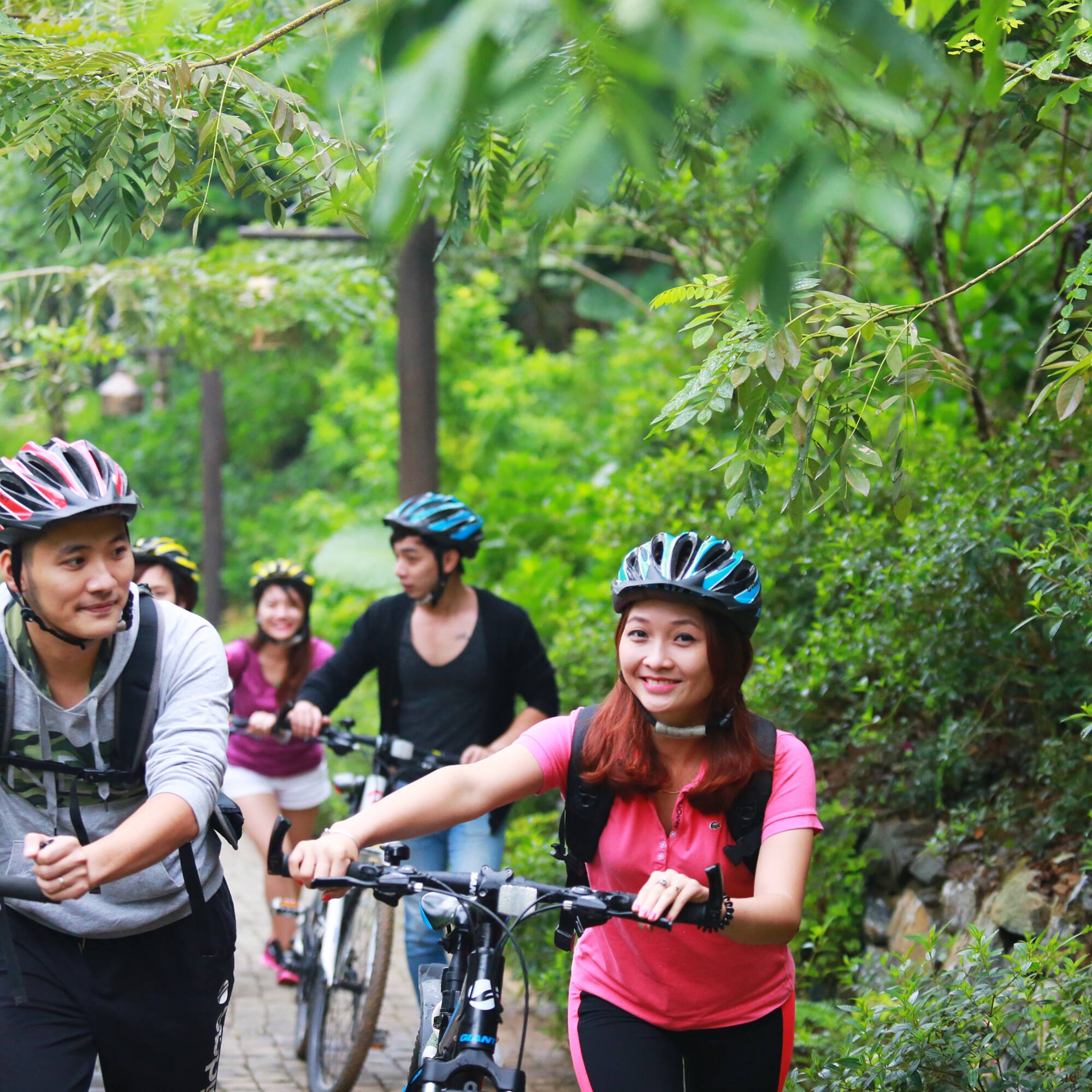 a group of people riding bikes