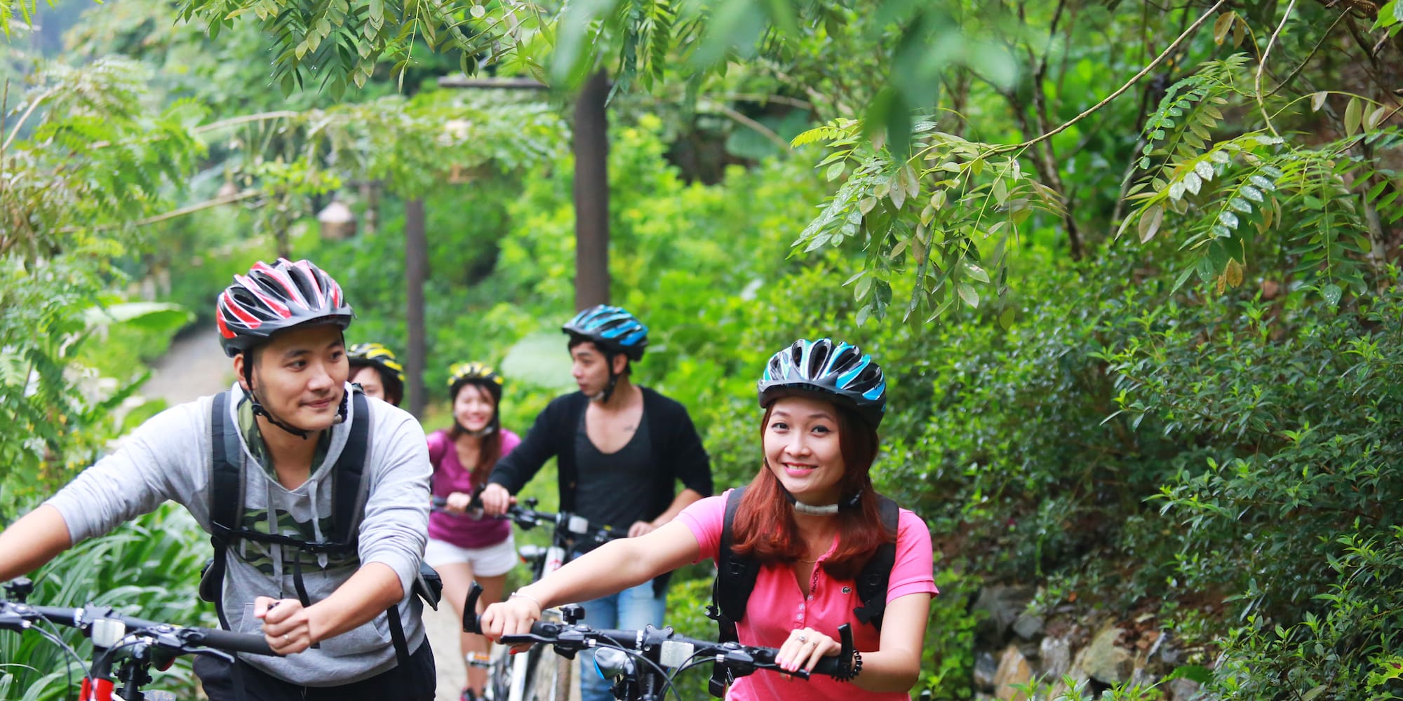 a group of people riding bikes