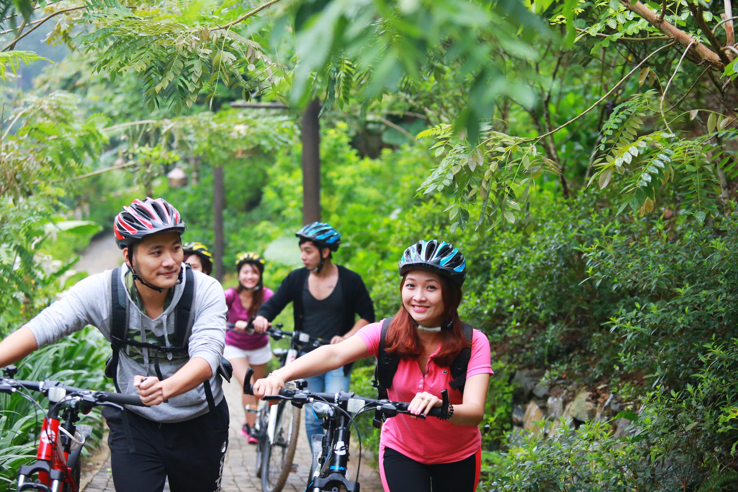 a group of people riding bikes