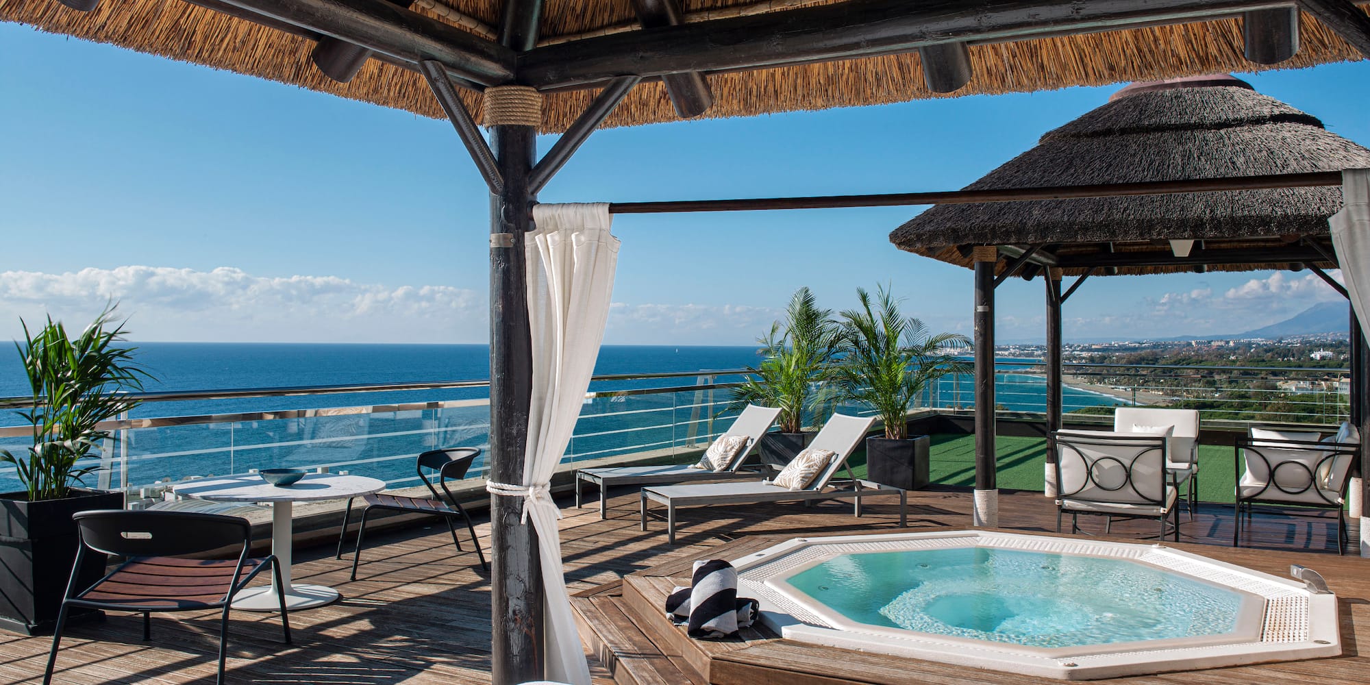 a hot tub with a view of the ocean