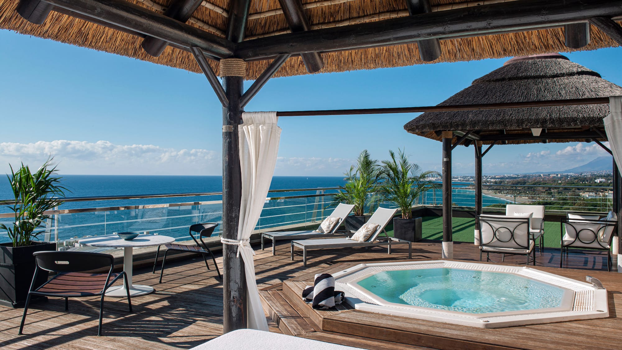 a hot tub with a view of the ocean