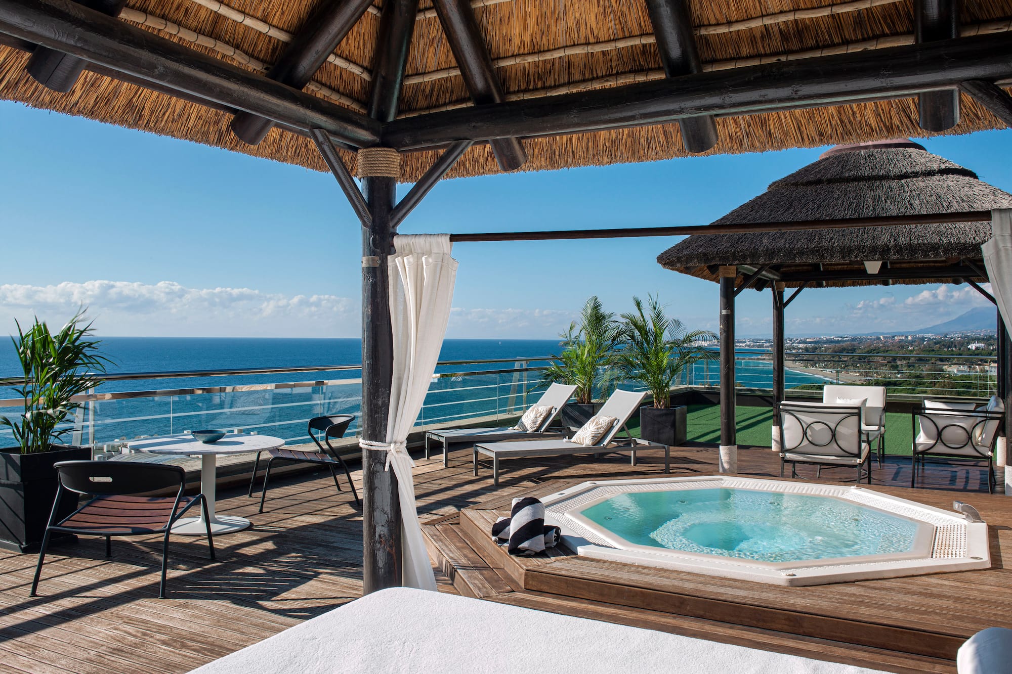 a hot tub with a view of the ocean