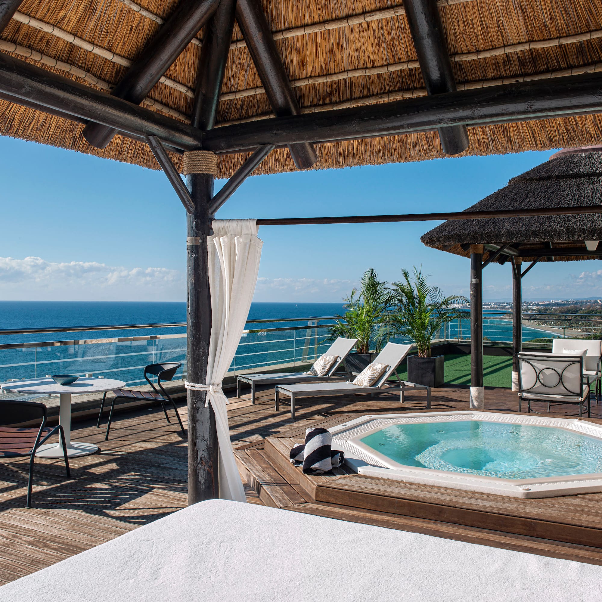 a hot tub with a view of the ocean
