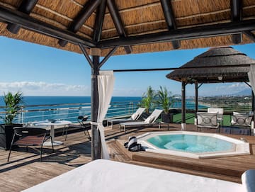 a hot tub with a view of the ocean