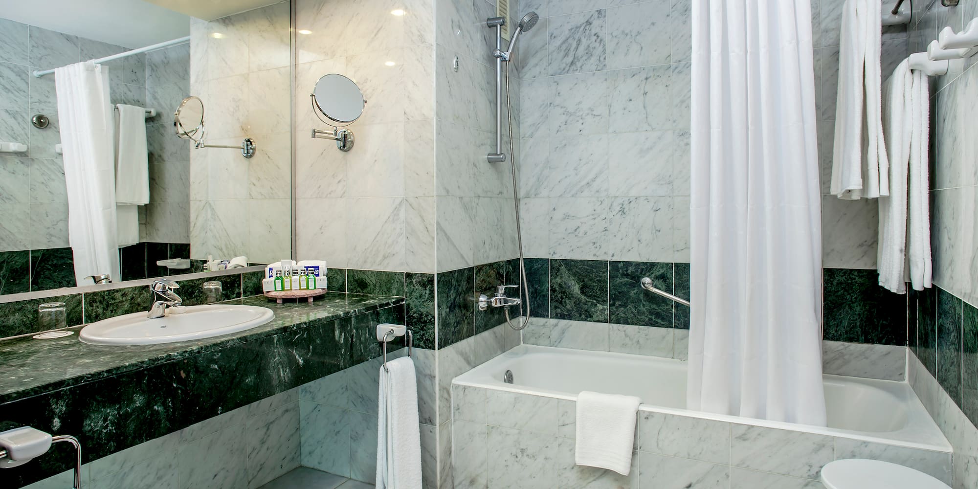 a bathroom with a shower and sink