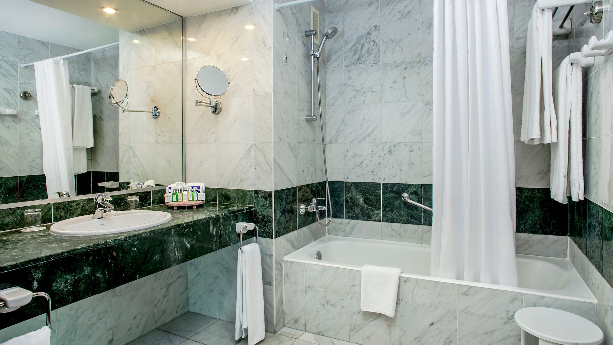 a bathroom with a shower and sink