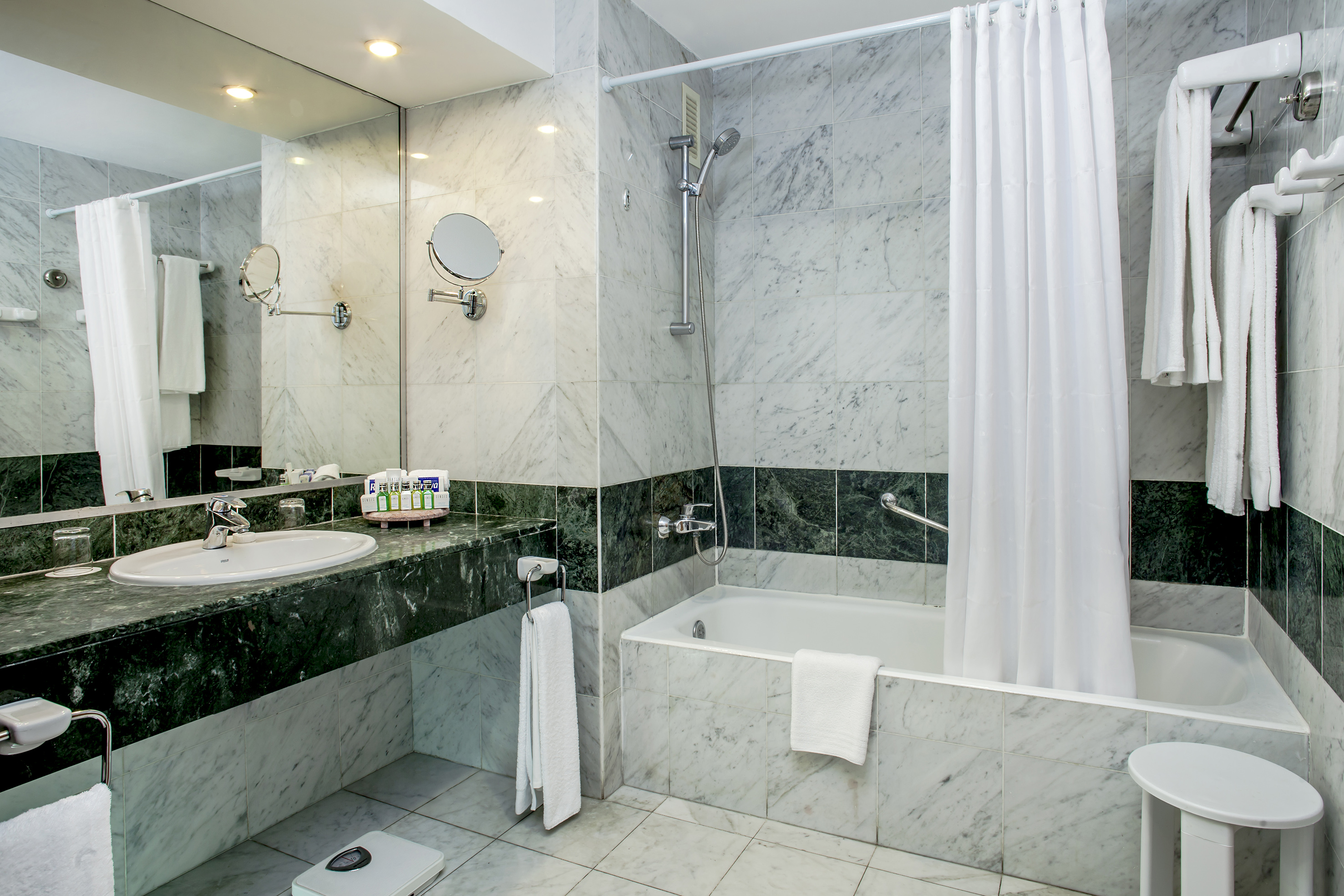 a bathroom with a shower and sink