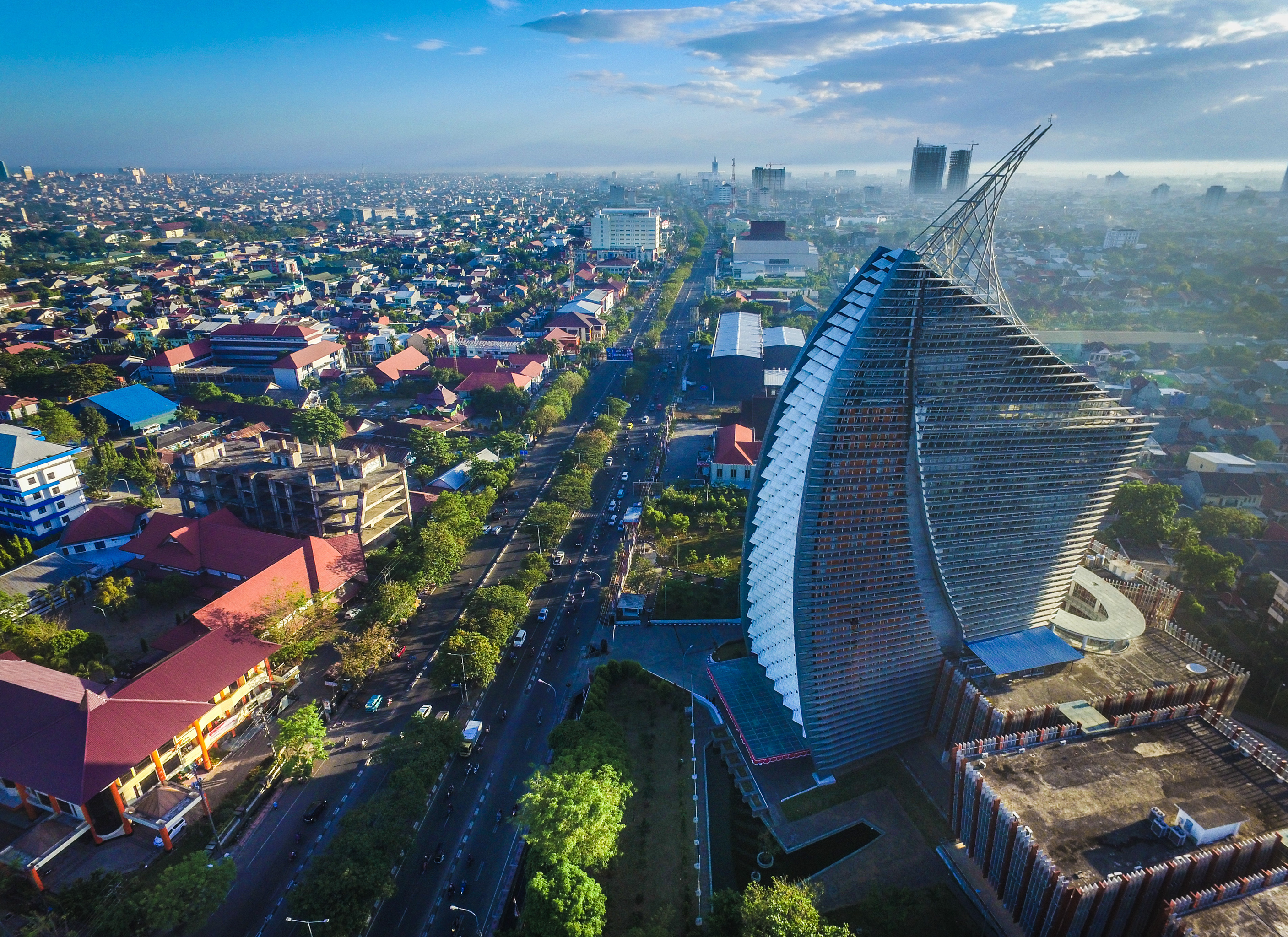 Makassar urban aerial view with distinctive Governor's Office architecture.