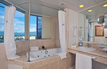 a bathroom with a tub and sink