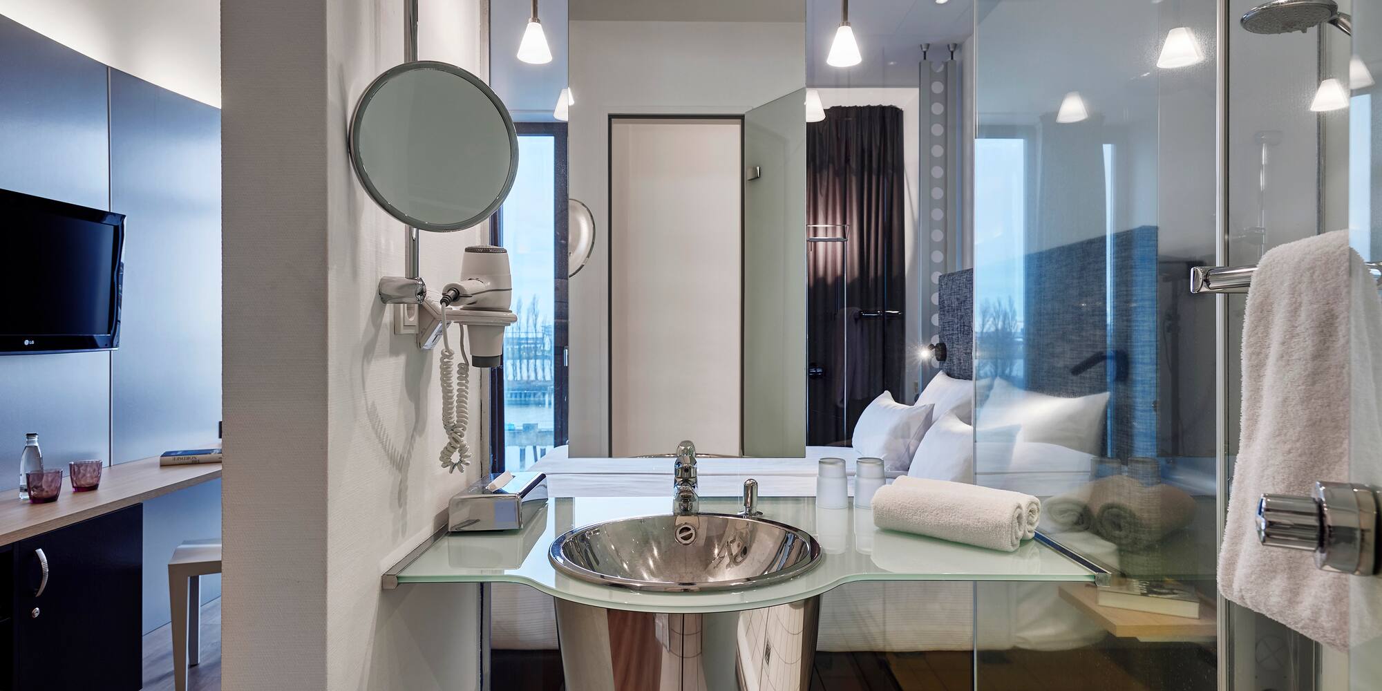 a bathroom with a mirror and sink