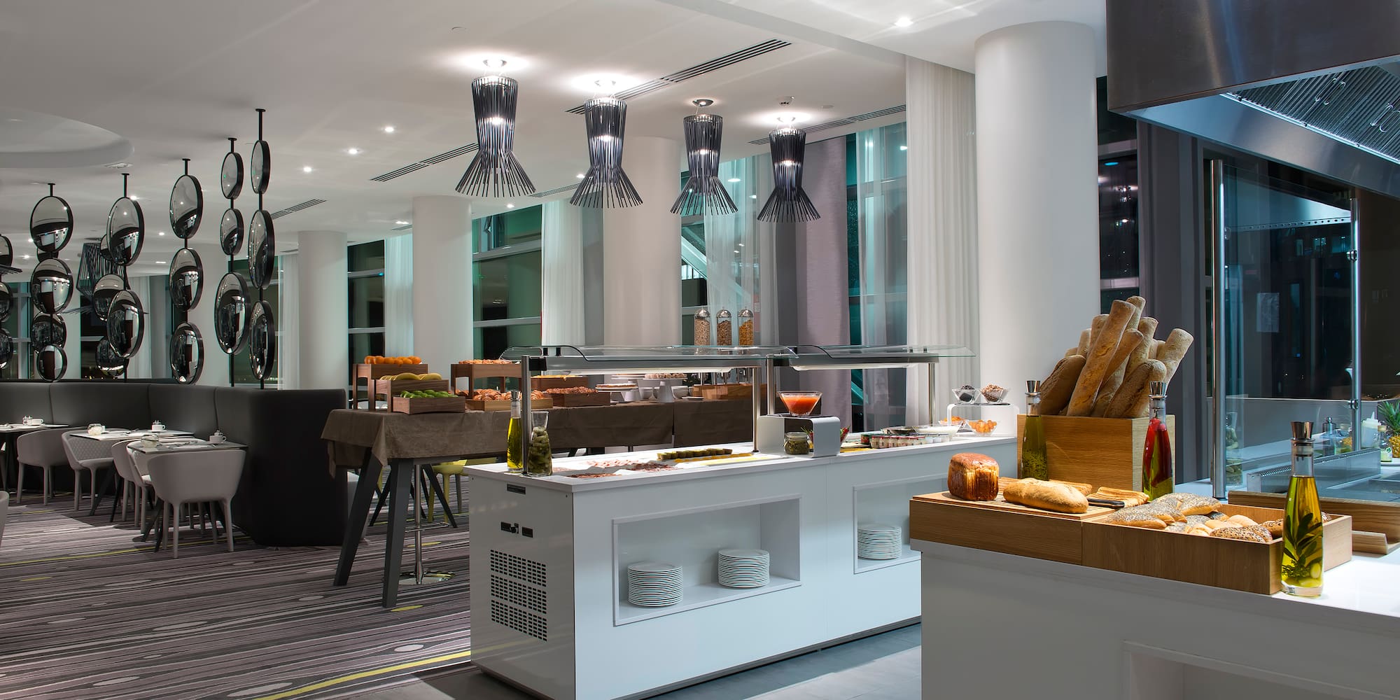 a restaurant with a buffet and a large window