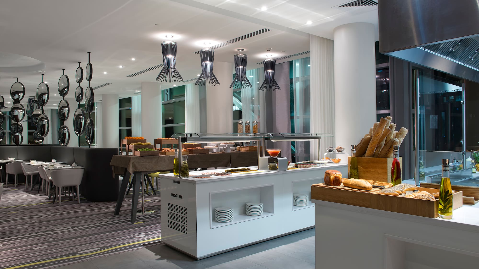 a restaurant with a buffet and a large window