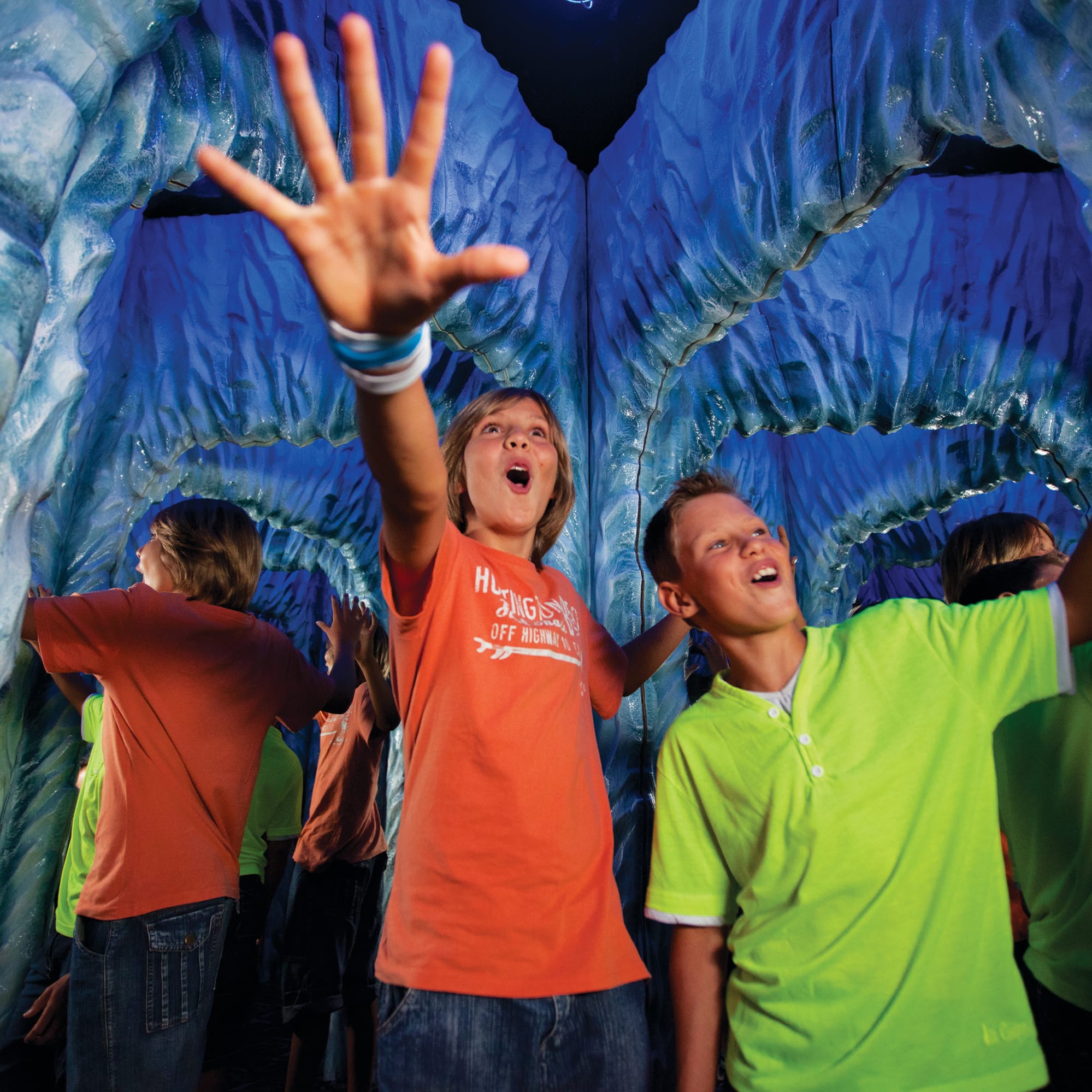 a group of kids in a tunnel
