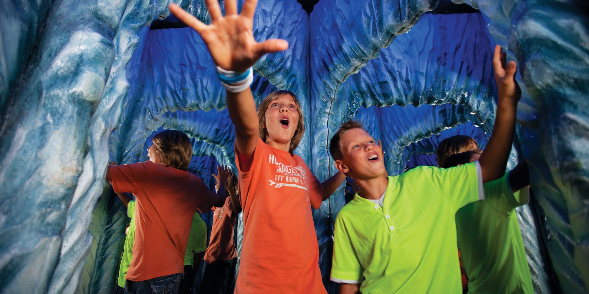 a group of kids in a tunnel