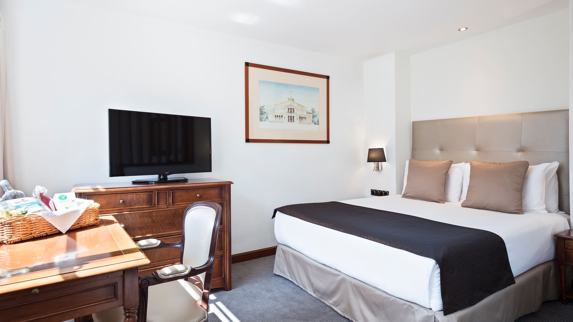 a bedroom with a bed and a desk