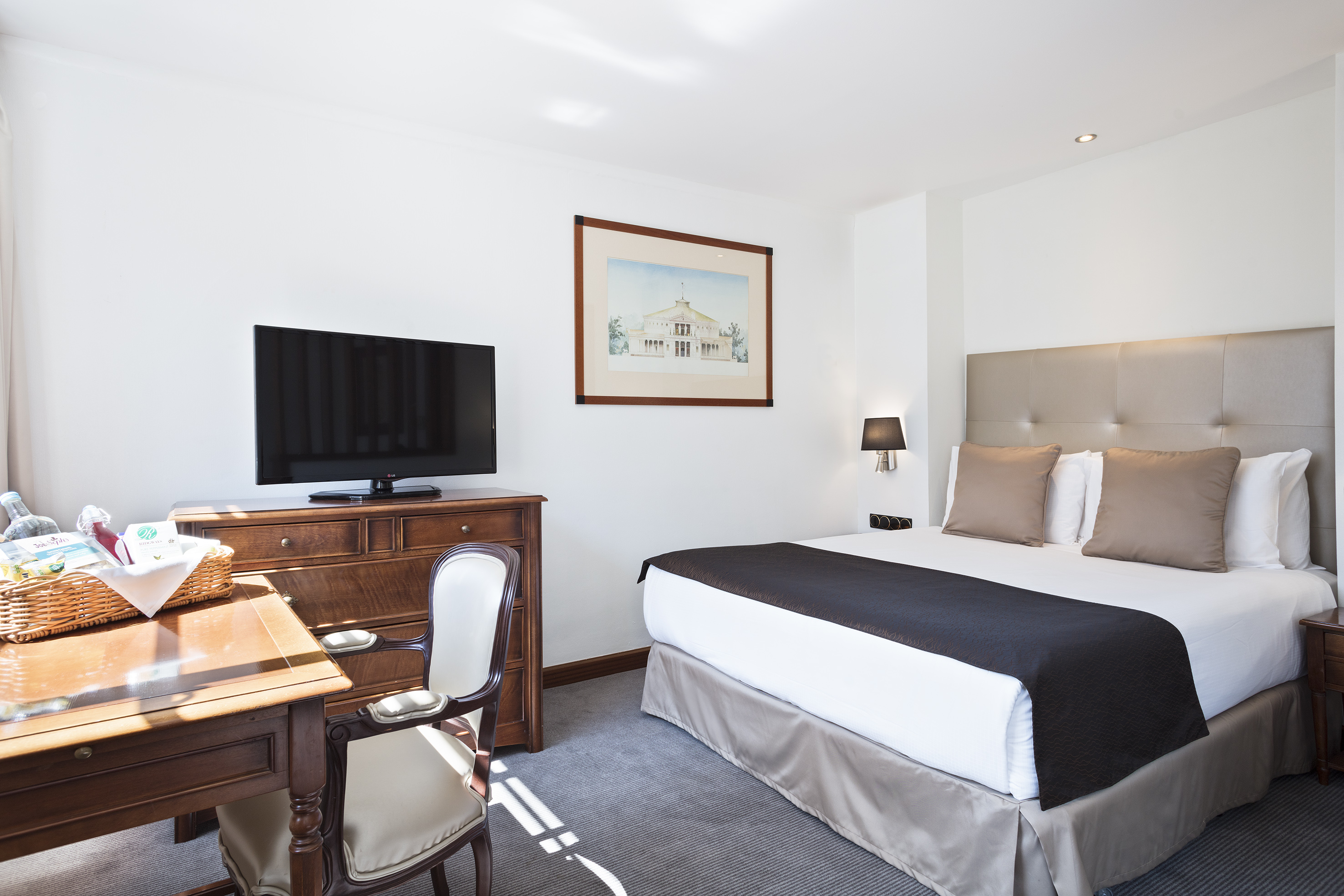 a bedroom with a bed and a desk