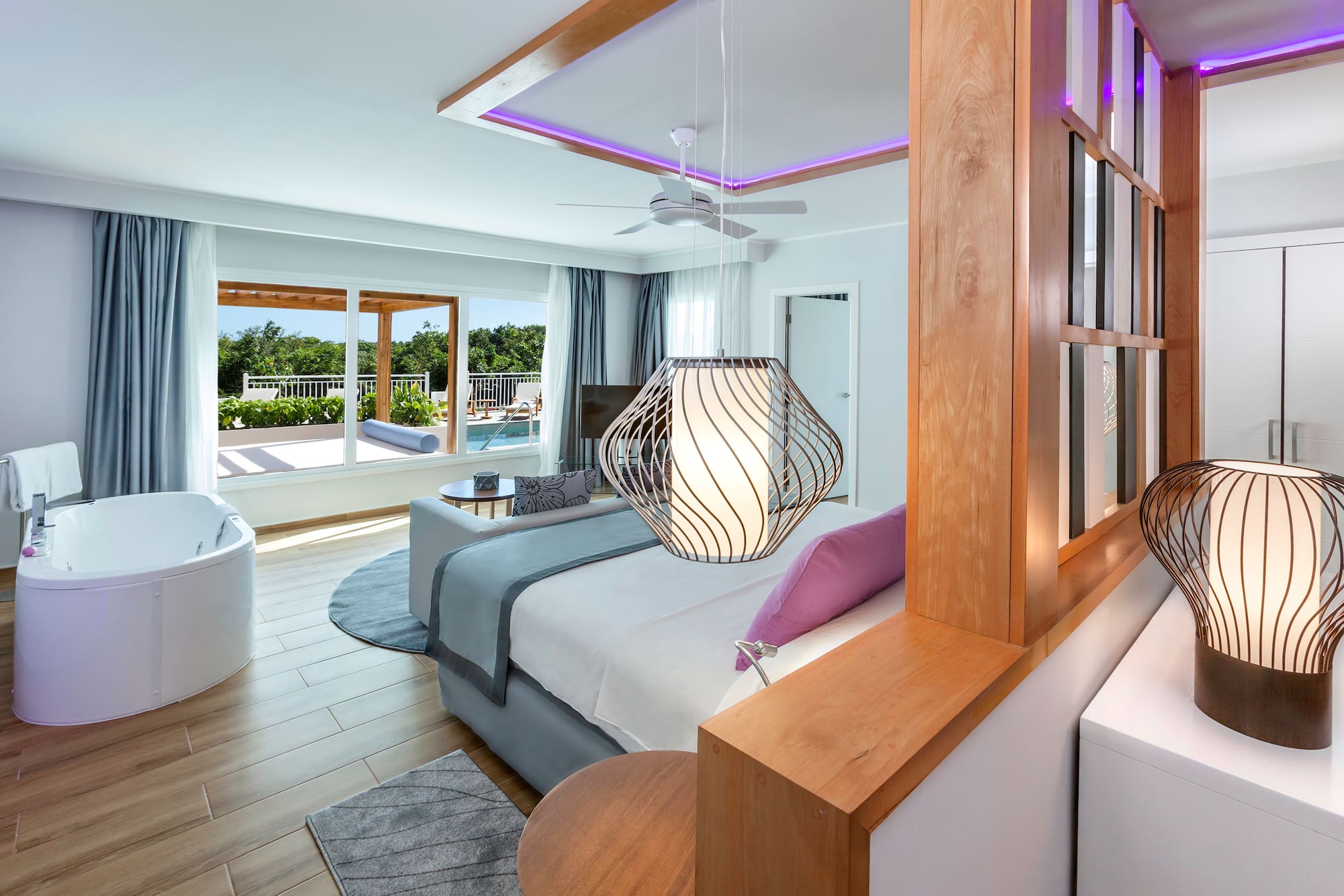 a room with a bed and a tub