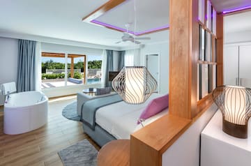 a room with a bed and a tub