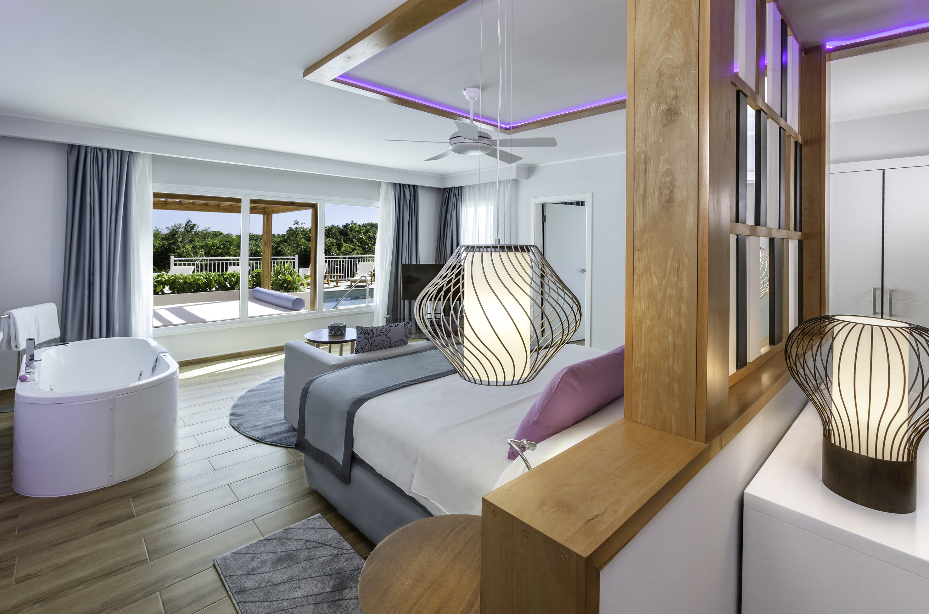 a room with a bed and a tub