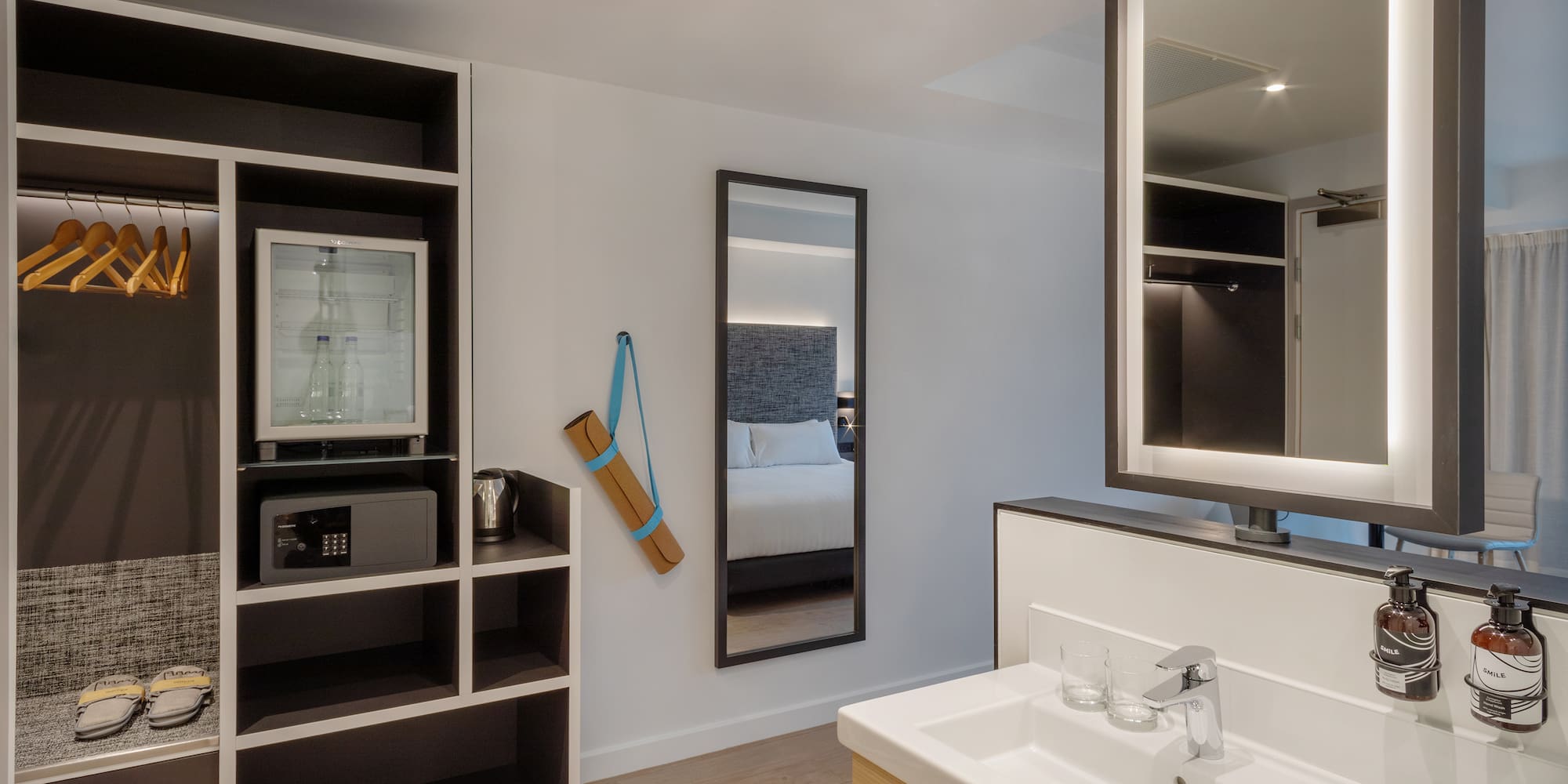 a bathroom with a mirror and shelves