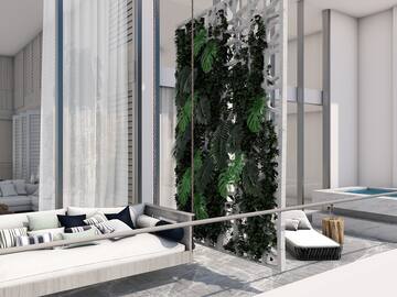 a balcony with a couch and plants