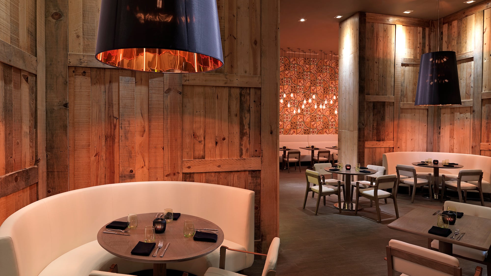 a room with a round table and chairs