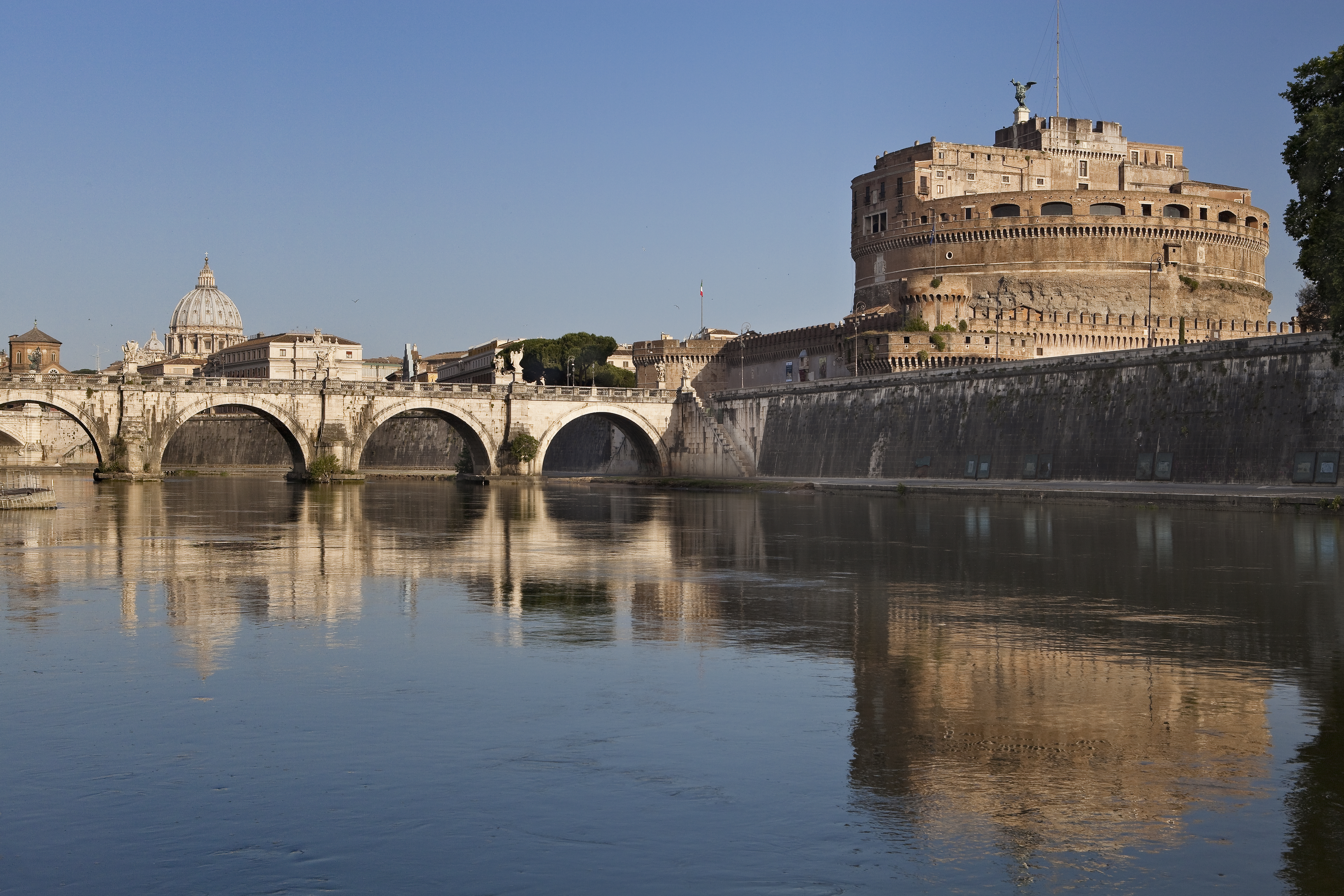 Castel Sant'Angelo, Ponte Sant'Angelo, and St. Peter's Basilica along Tiber River, Rome.
