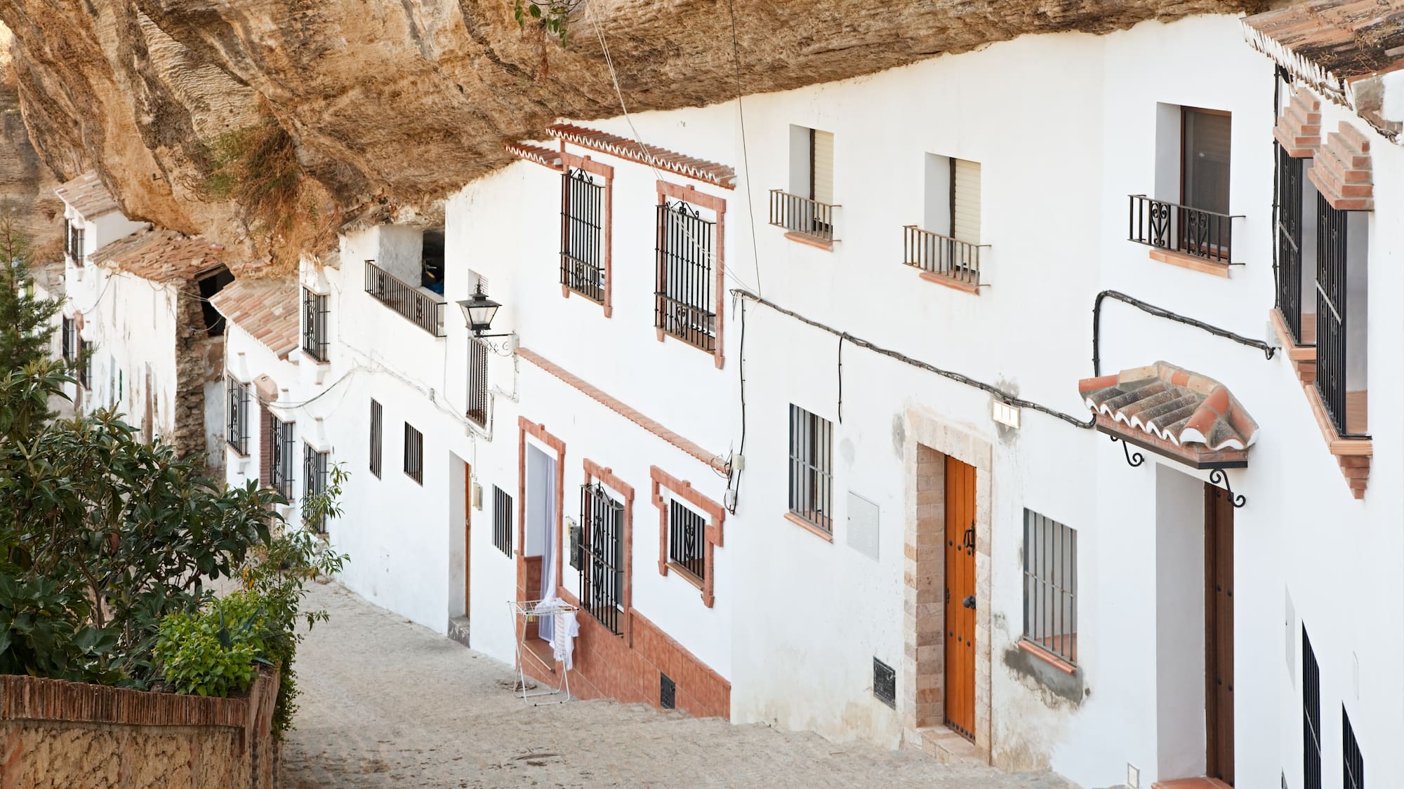 a stone path between buildings