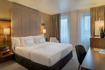a bed with a desk and chair in a room