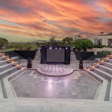 a stage with lights in the middle of a building
