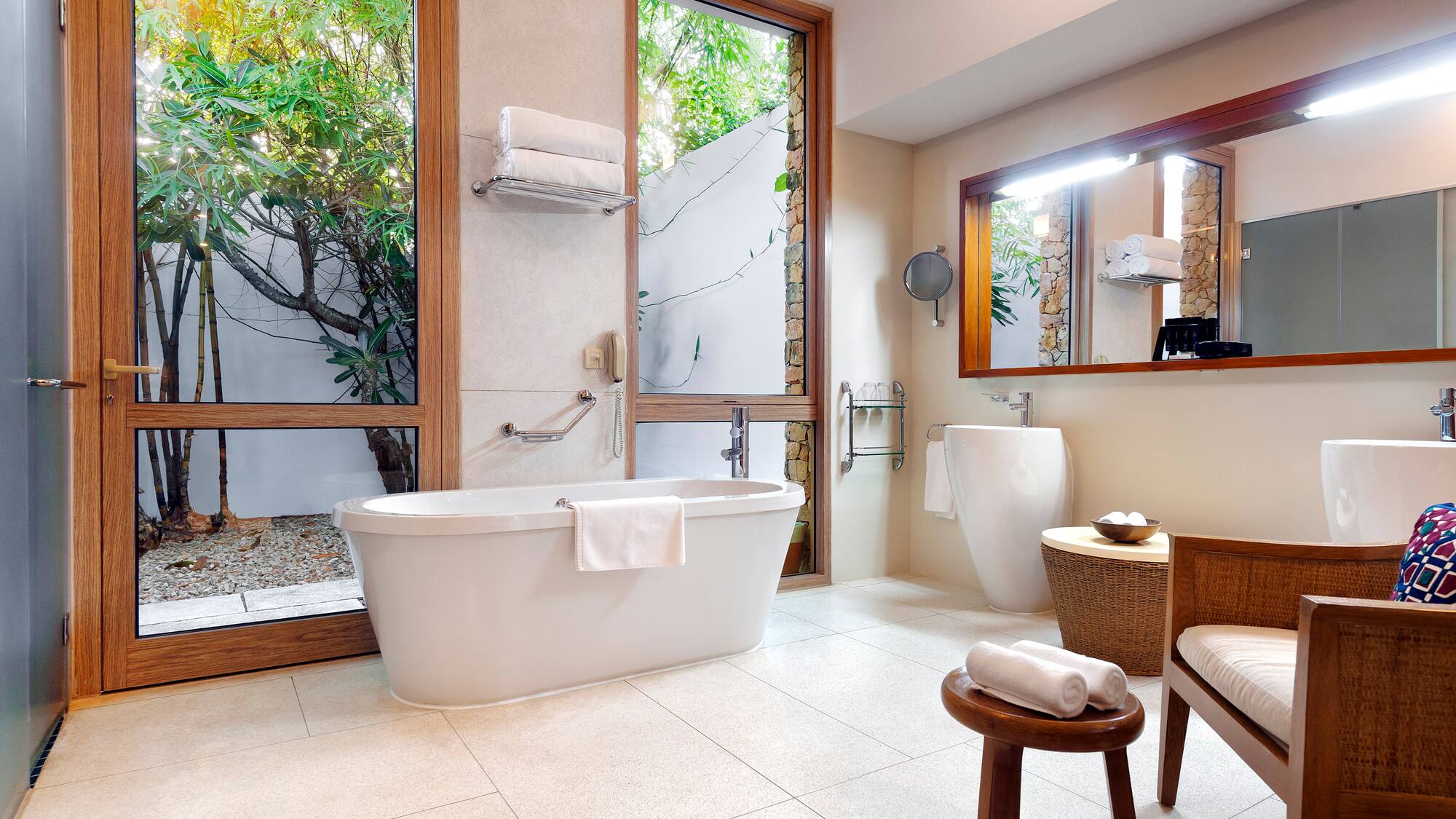 a bathroom with a tub and a toilet