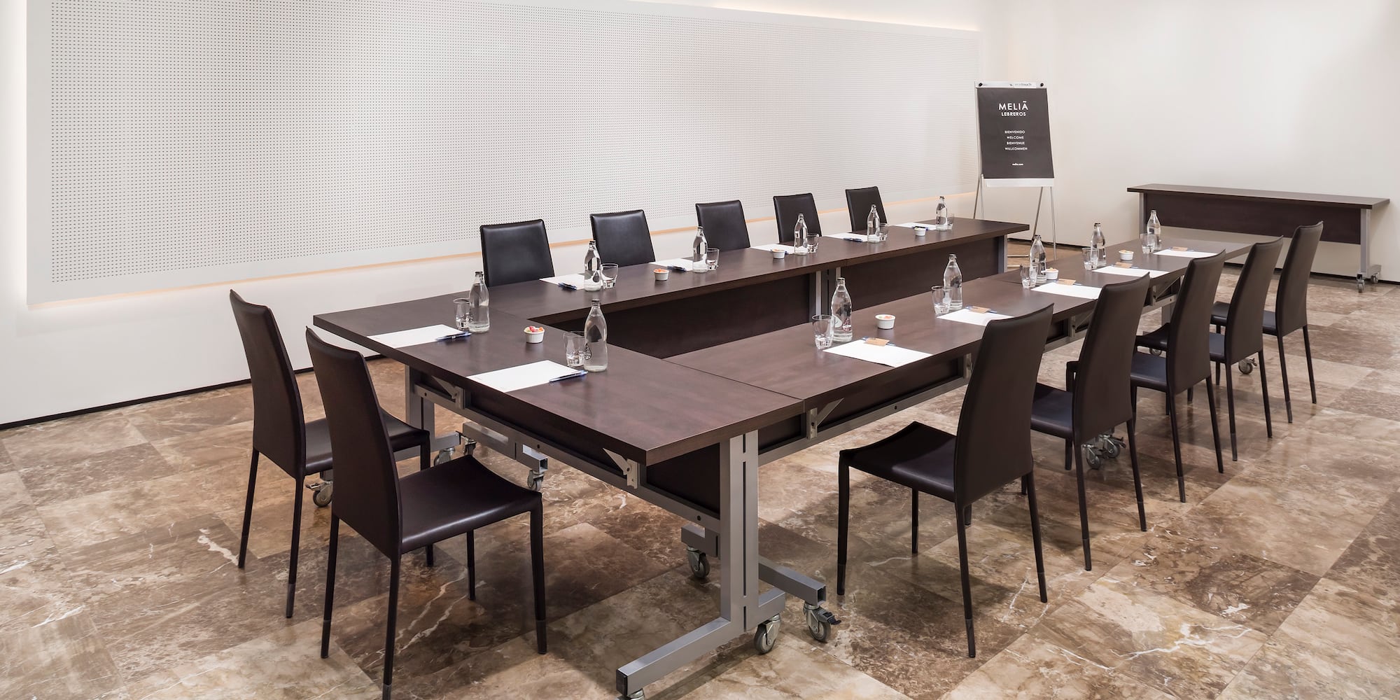 a conference room with a table and chairs