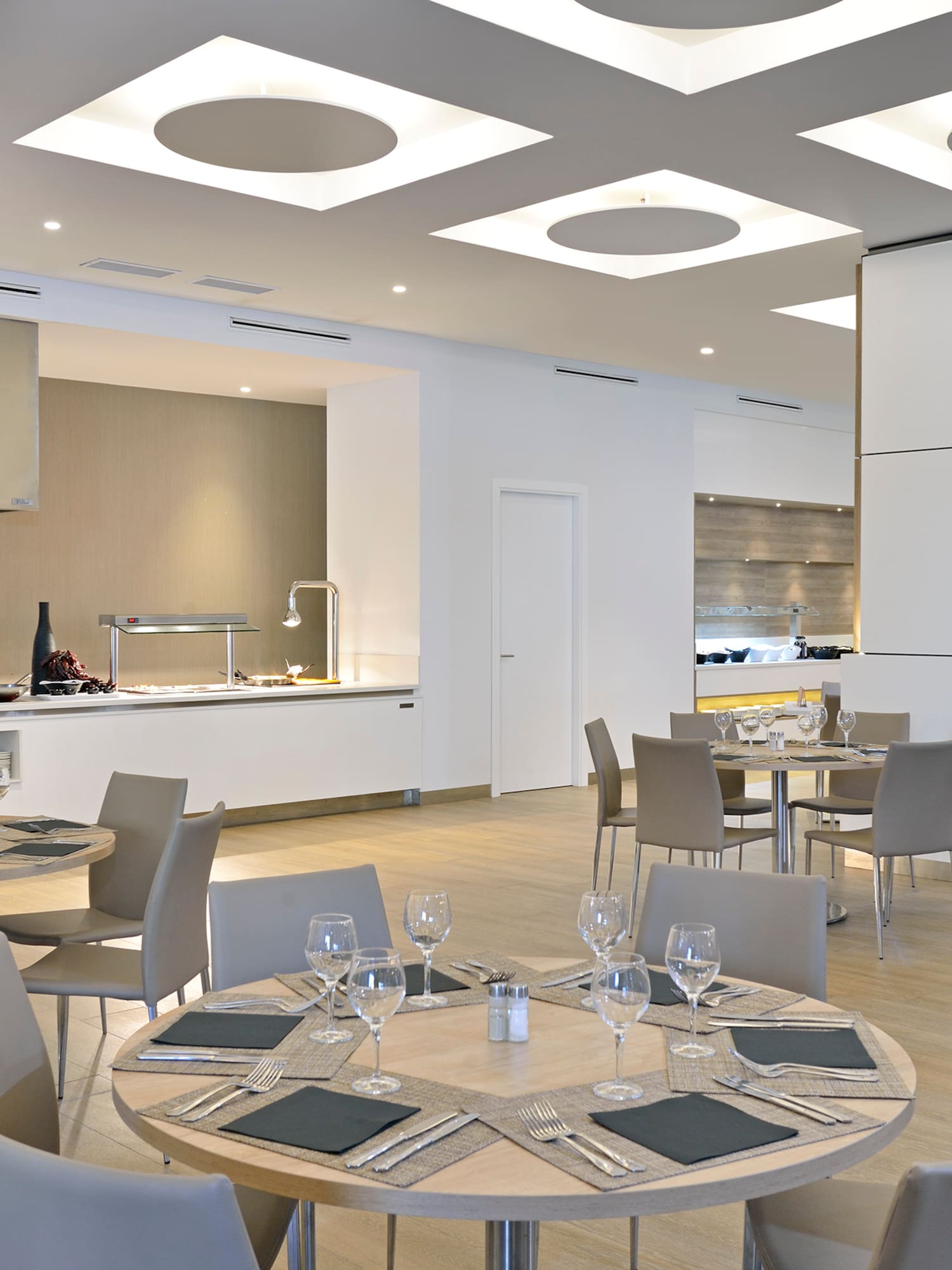 a restaurant with a chef in the background