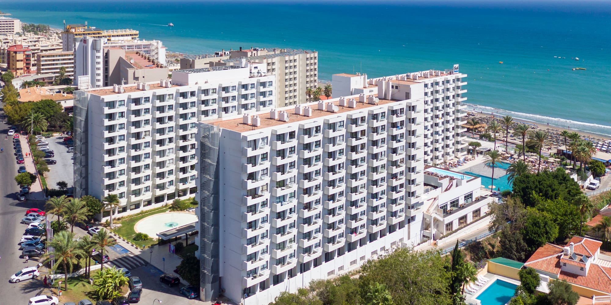 a group of buildings next to a body of water