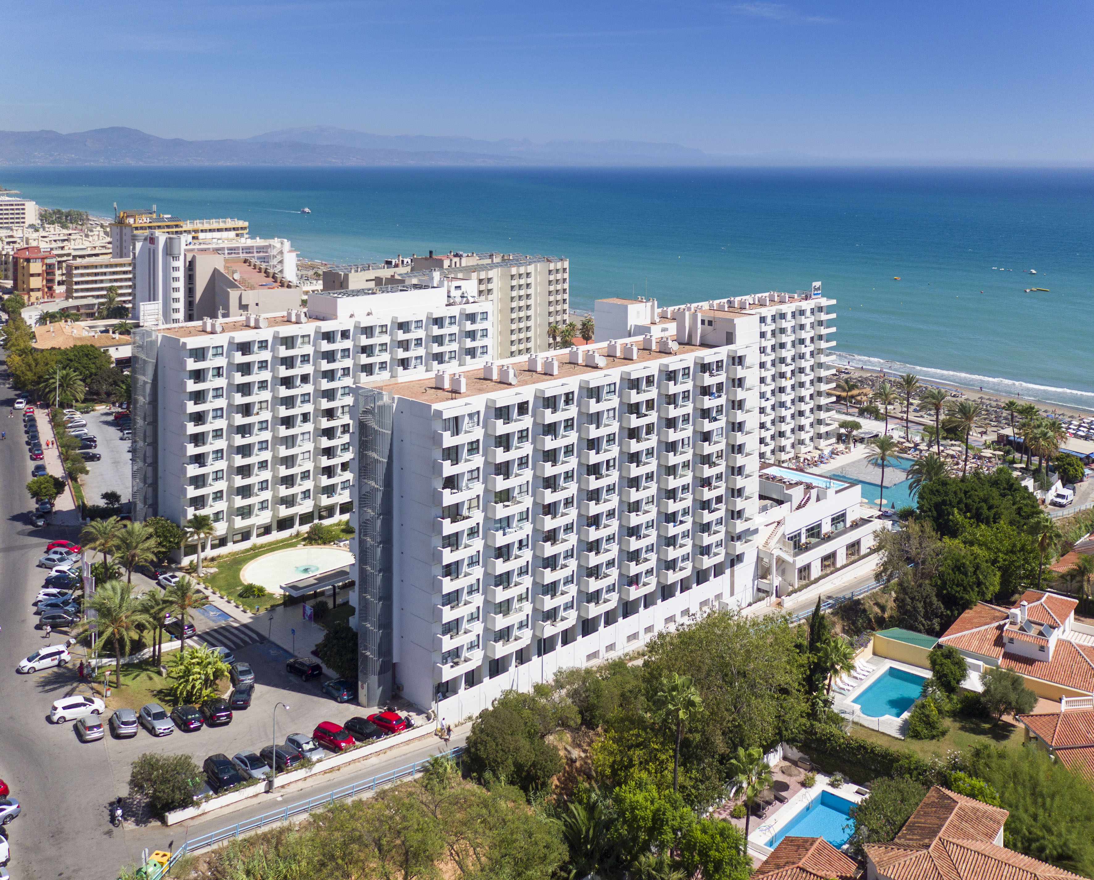 a group of buildings next to a body of water