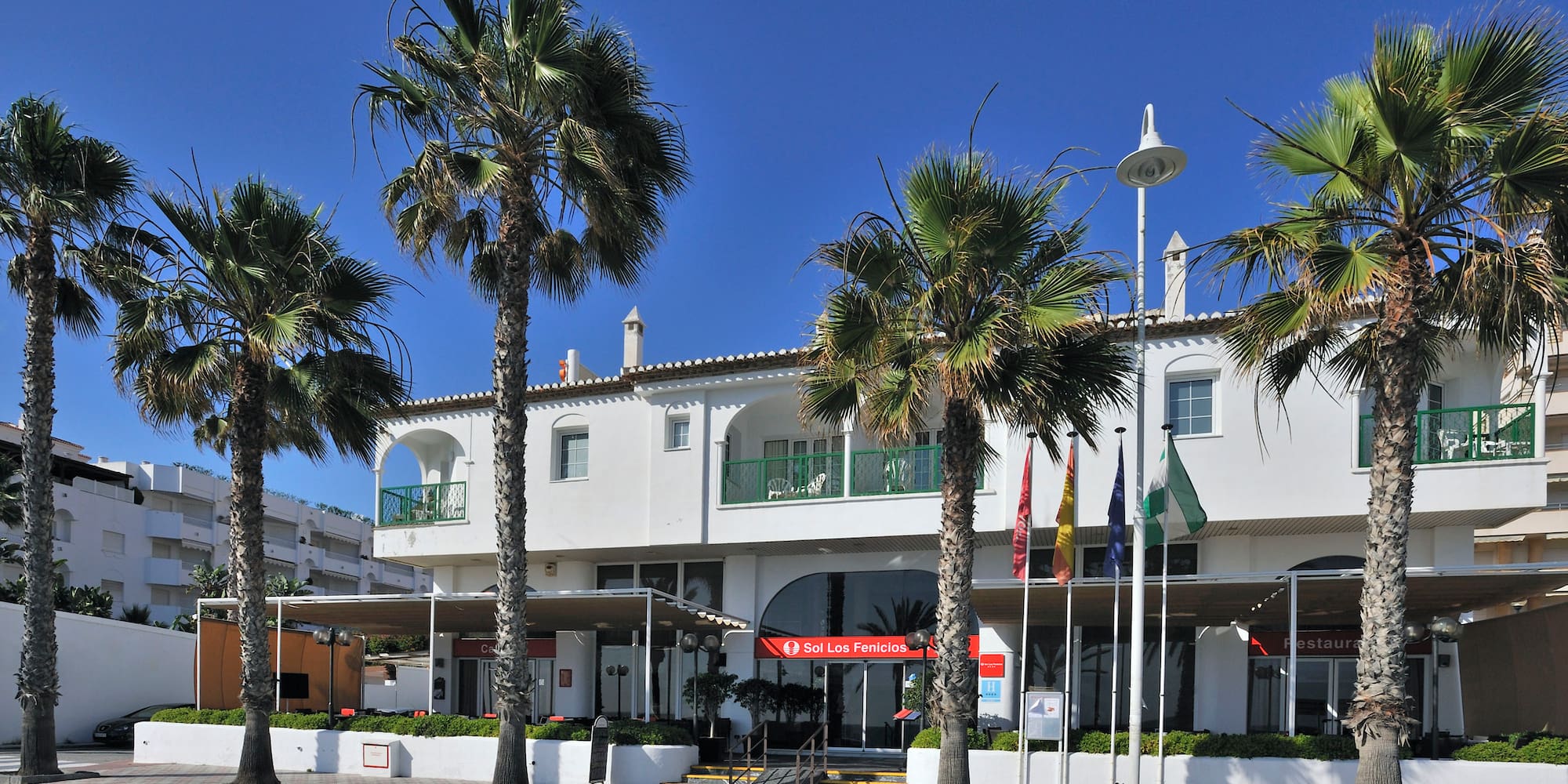 a building with palm trees