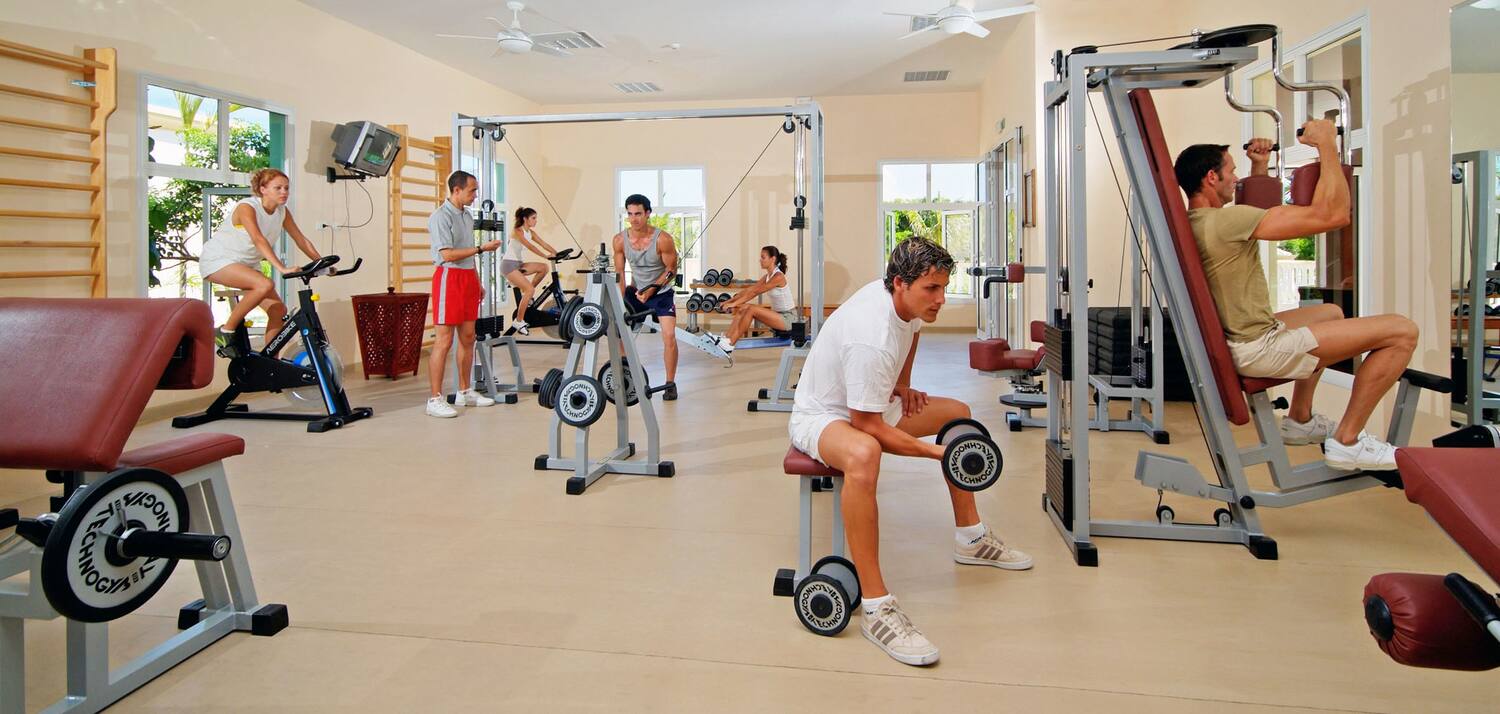 a group of people working out in a gym