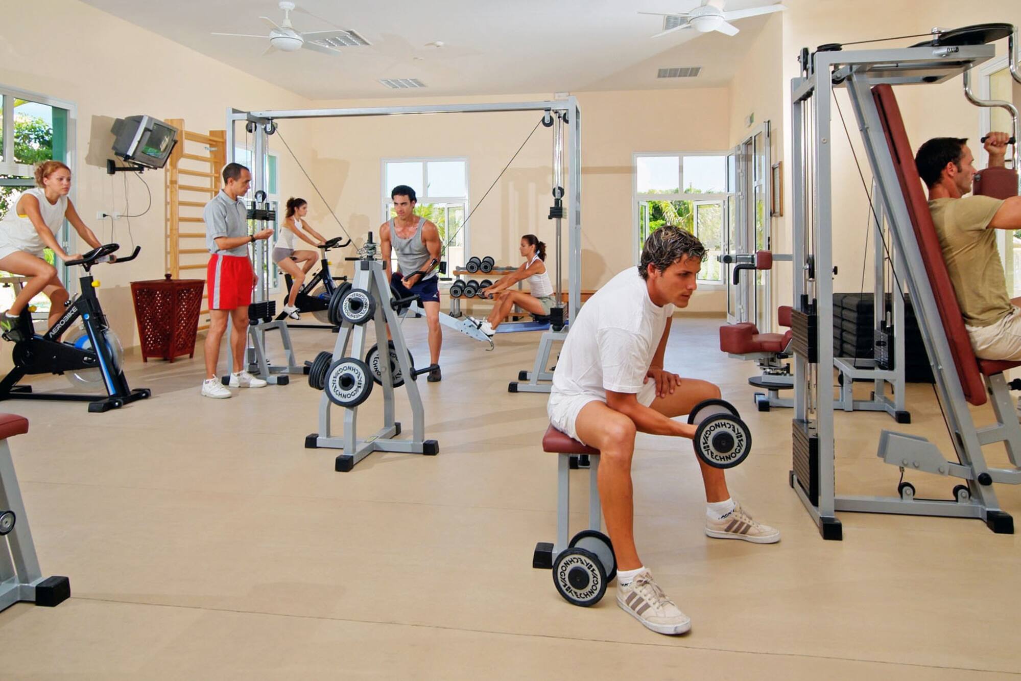 a group of people working out in a gym