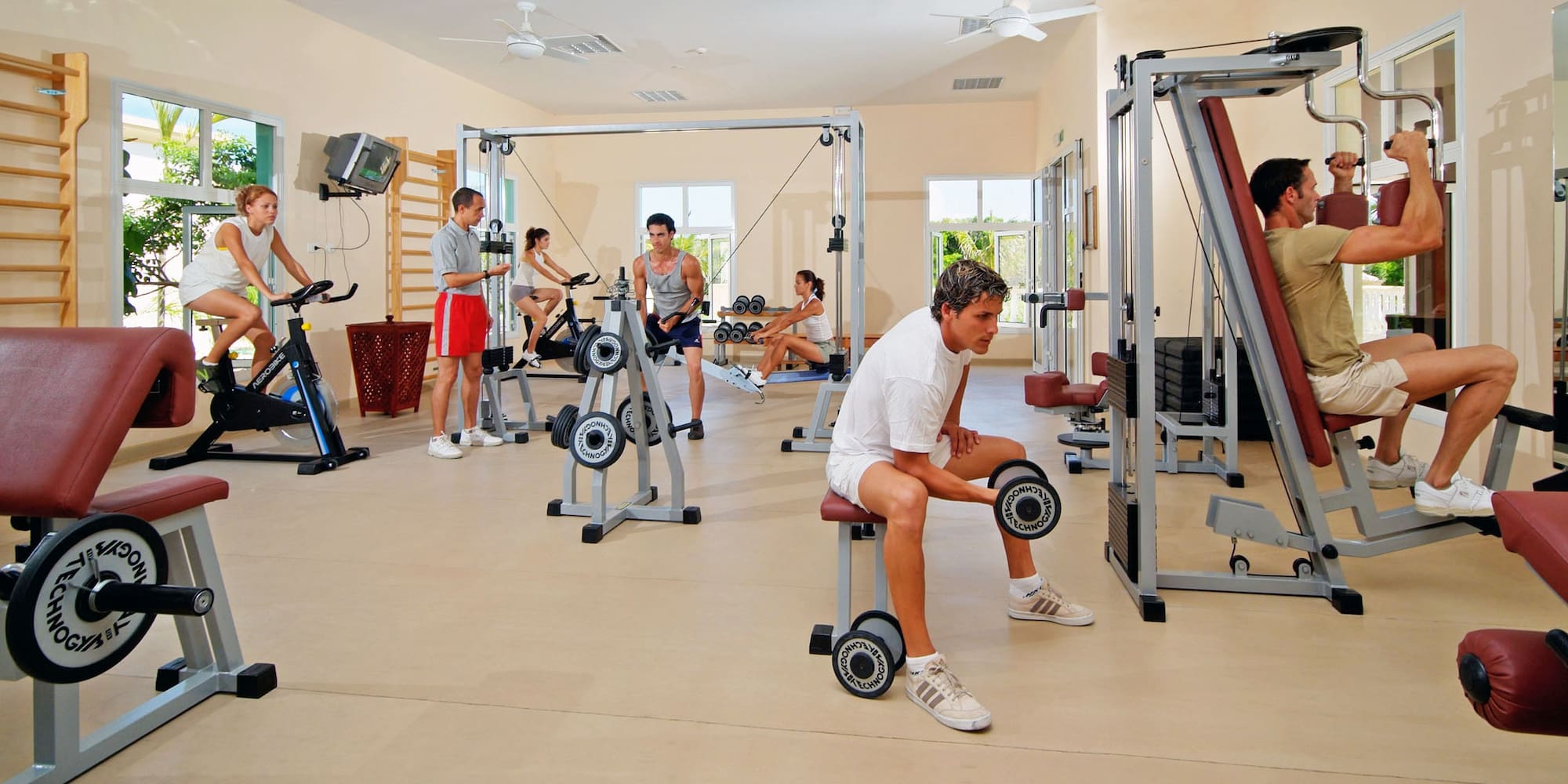 a group of people working out in a gym