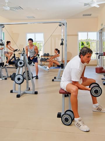 a group of people working out in a gym