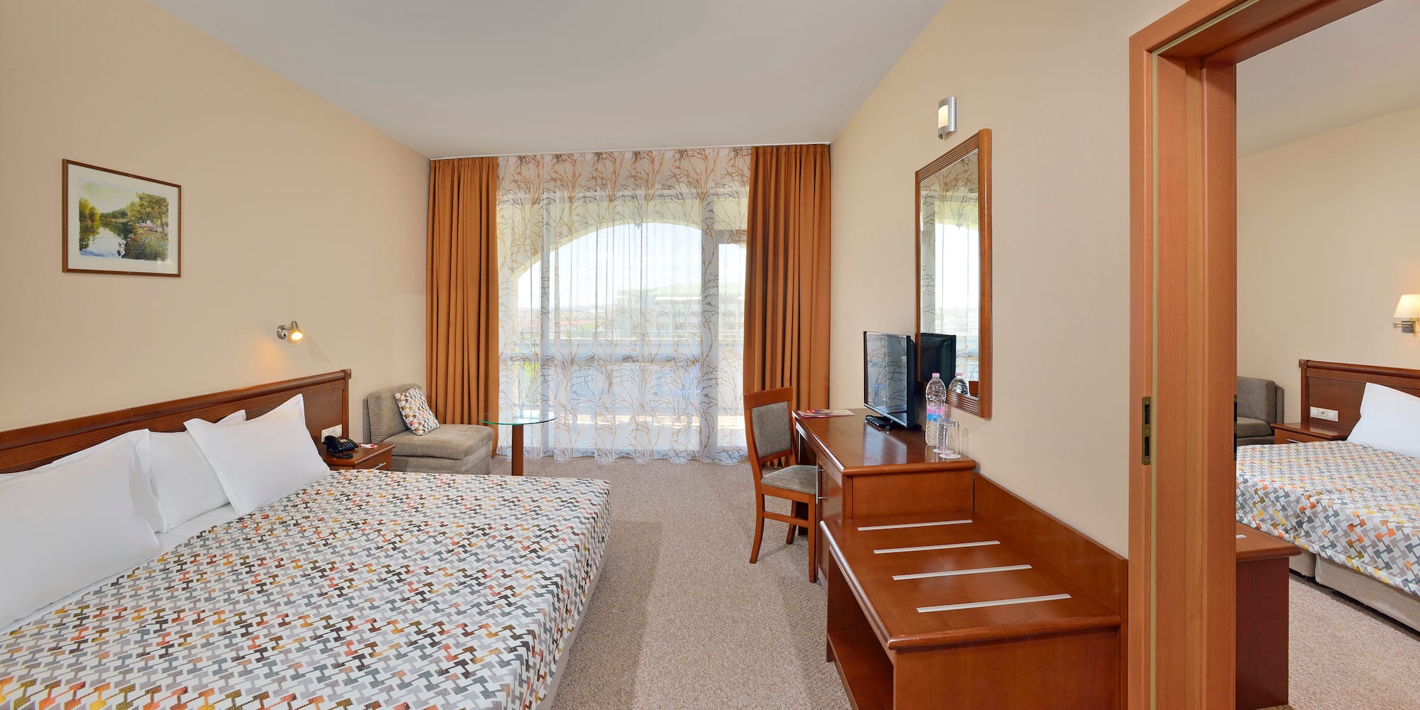 a room with a bed and a desk