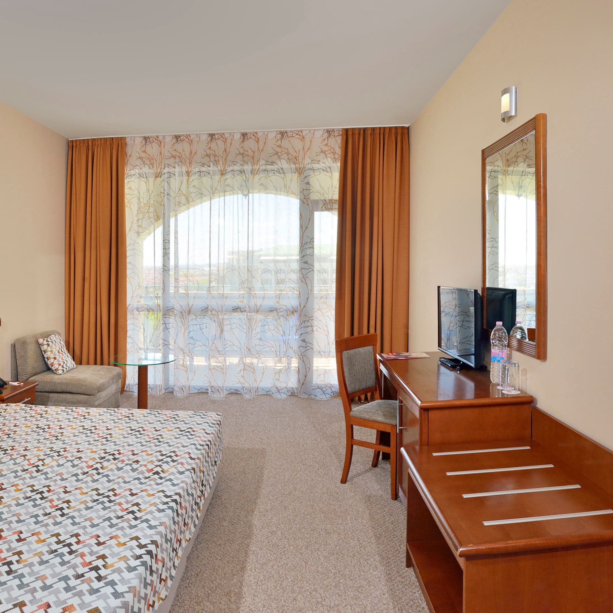 a room with a bed and a desk